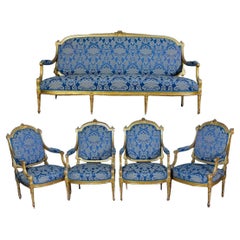 Elegant French 19' Century Gilt Living Room Suite with a Sofa and Four Armchairs