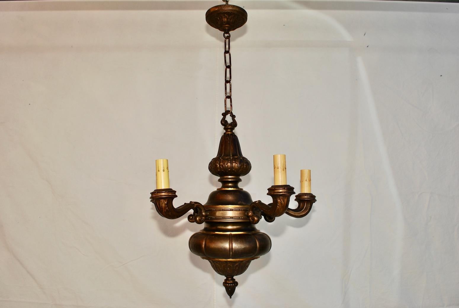 An elegant French brass chandelier, the height can be shorter, the patina is much nicer in person.

      