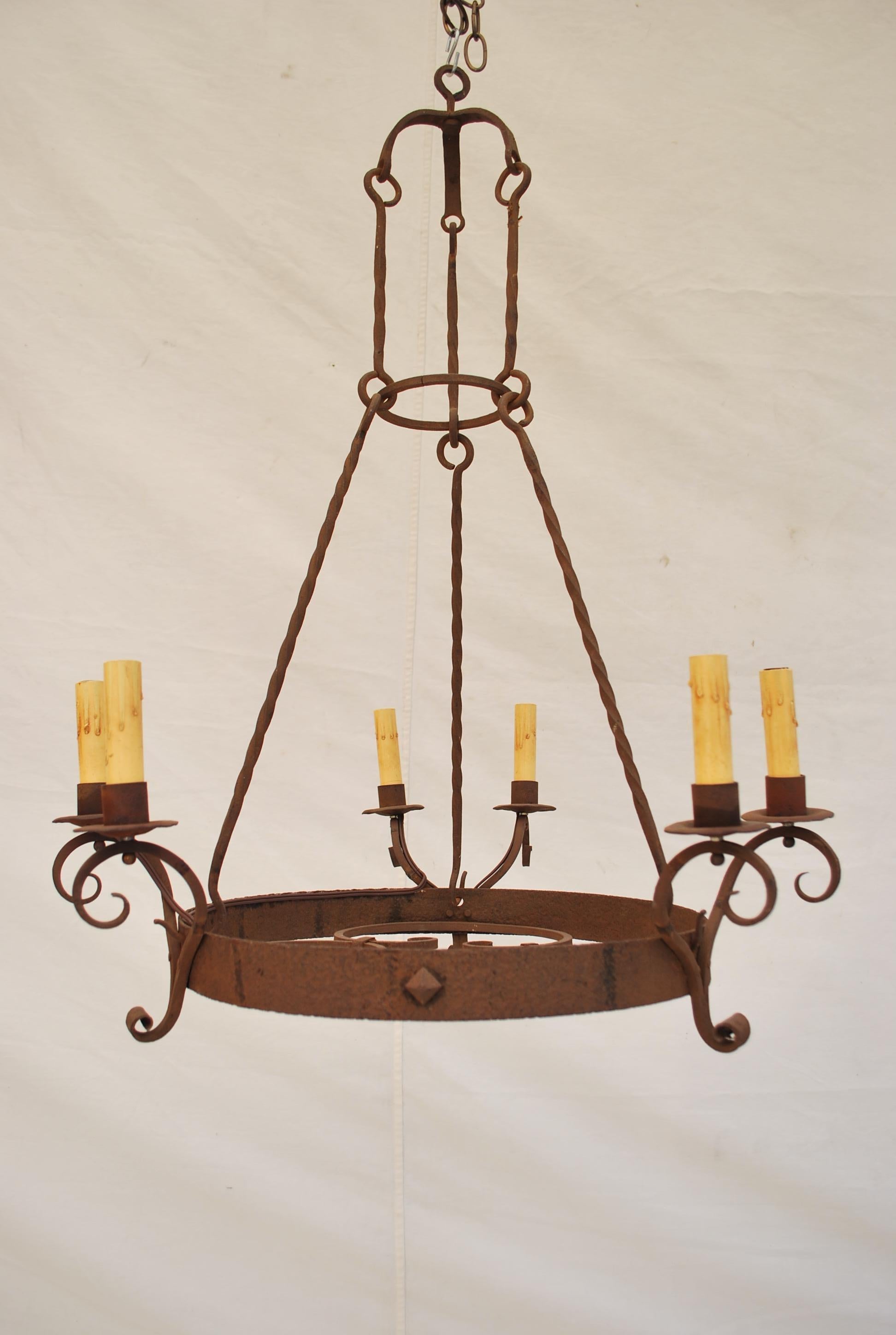 An elegant French 1920's all hands made wrought iron chandelier, the patina is so nicer in person