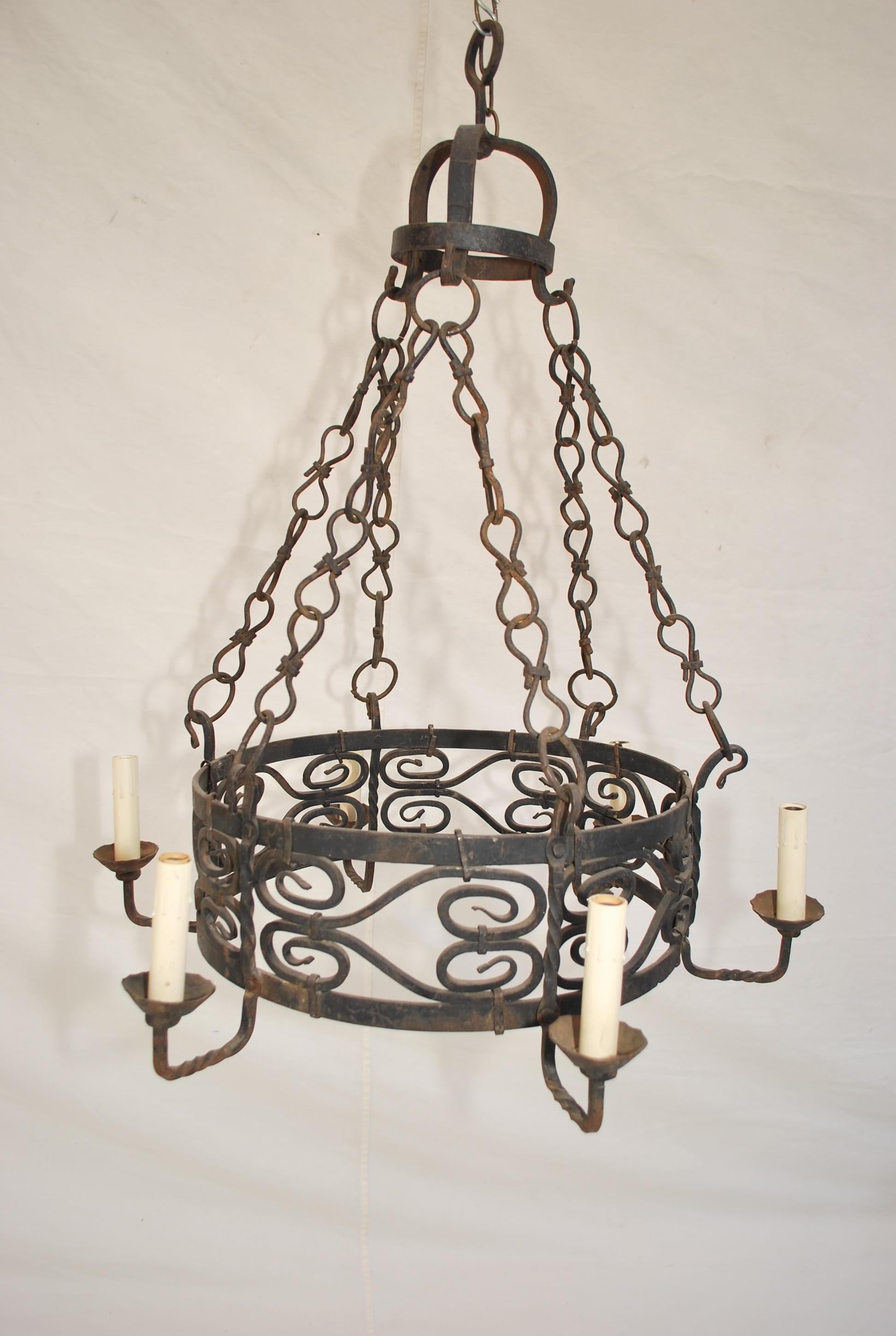 Hammered Elegant French 1920's hands made wrought iron chandelier For Sale