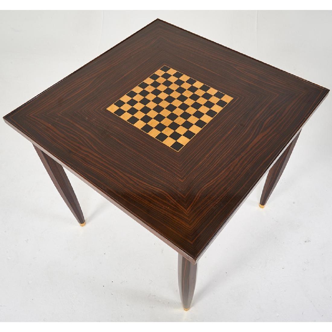 Elegant French game table in Macassar and ebony wood with an inset chest board.
with gilded brass feet signed 