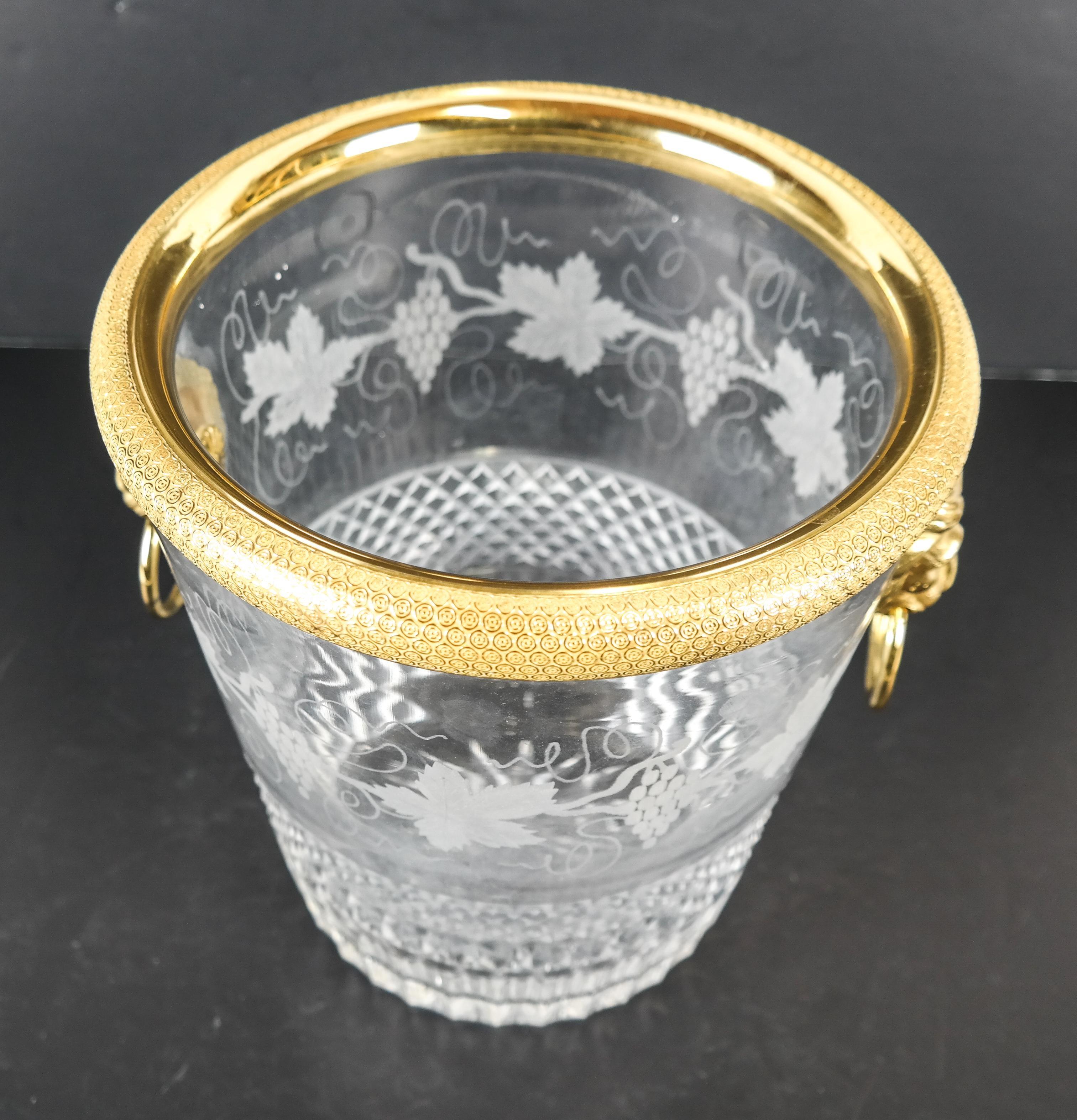 An elegant French Baccarat style lion handle, dore bronze cut and etched crystal ormolu ice bucket cooler

Measures: 9