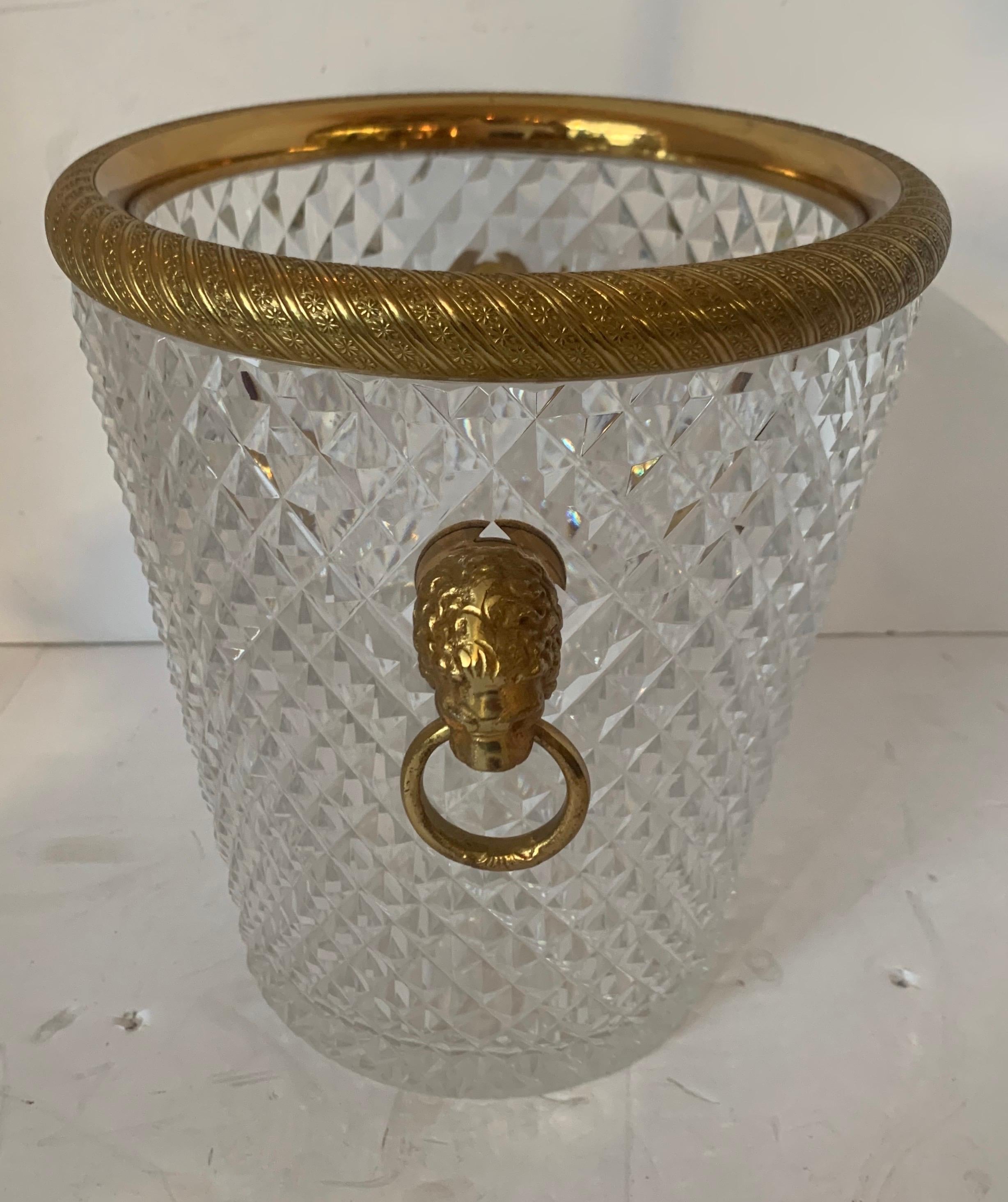An elegant French Baccarat lion handle doré bronze cut crystal ormolu ice bucket.