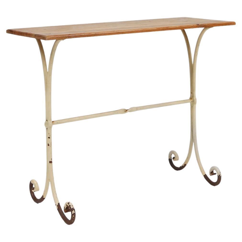 Elegant French bistro table with beige metal base and oak top, ca. 1950 For Sale