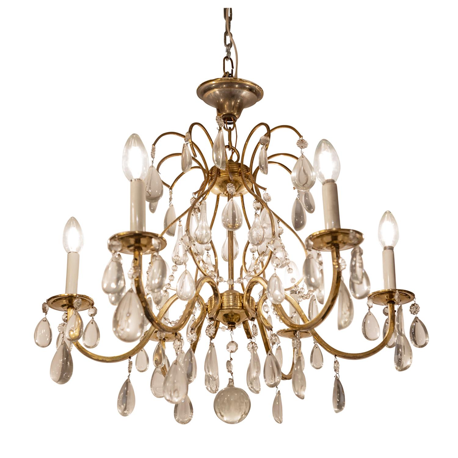 Elegant chandelier in brass with teardrop crystals and petite faceted crystals, French 1950's. This chandelier is very chic. The drop can be customized.