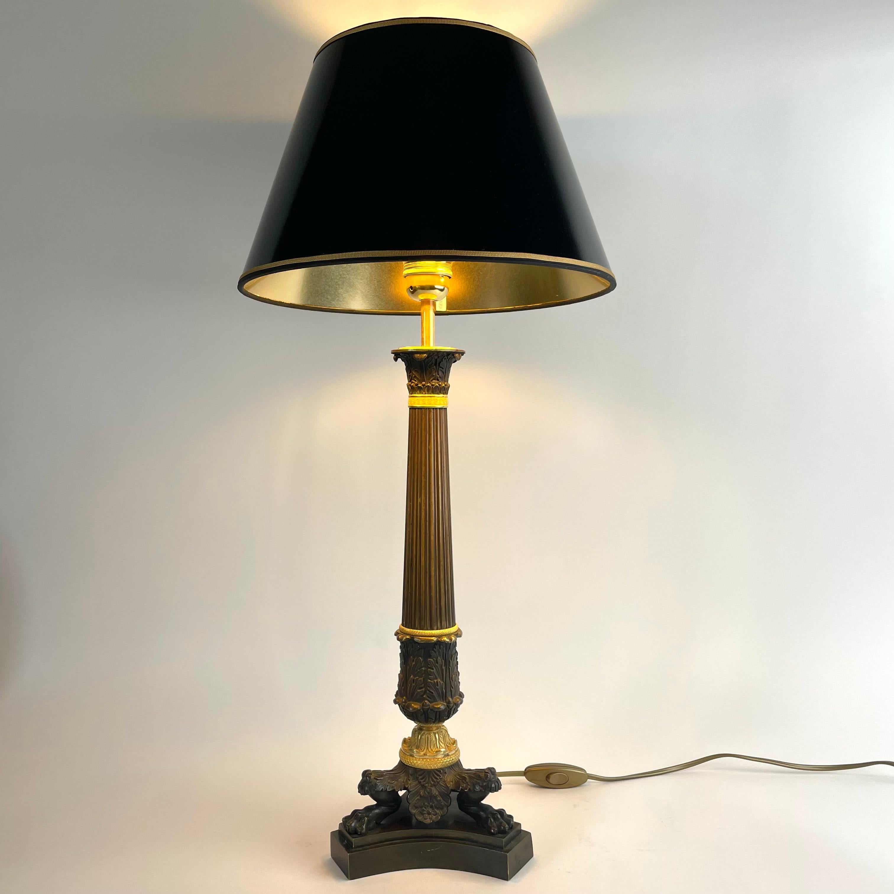 
French Empire Table Lamp in Patinated and Gilded Bronze, 1820s

Elegant French Empire table lamp crafted in patinated and mercury-gilded bronze, dating from the 1820s. Originally part of a candelabrum, this piece has been expertly converted into a