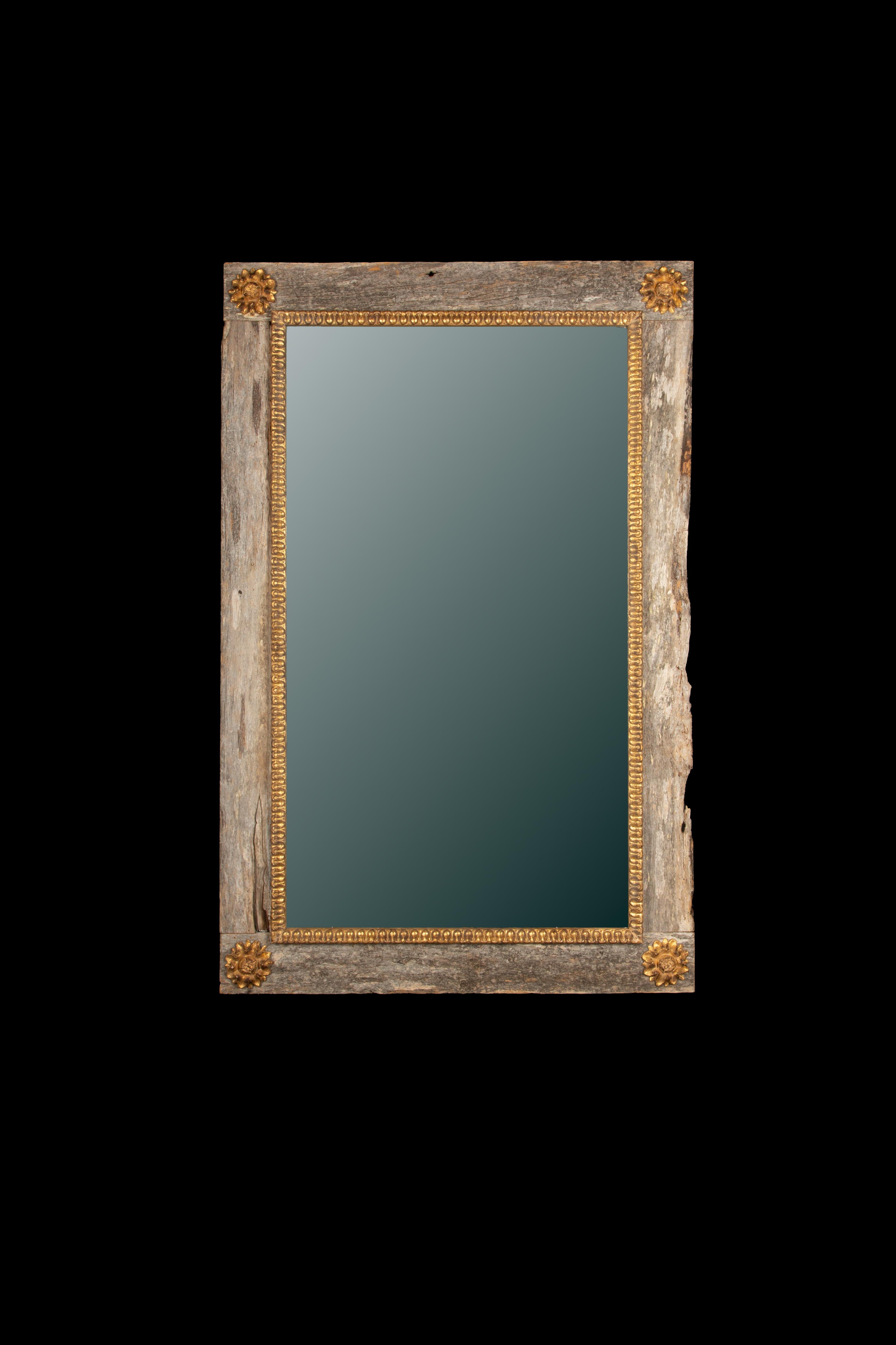 Rustic French Contemporary Mirror with Gilt Detailing
This striking French contemporary mirror is masterfully crafted from reclaimed wood, lending it a richly textured, weathered patina full of natural character and rustic appeal. The rectangular