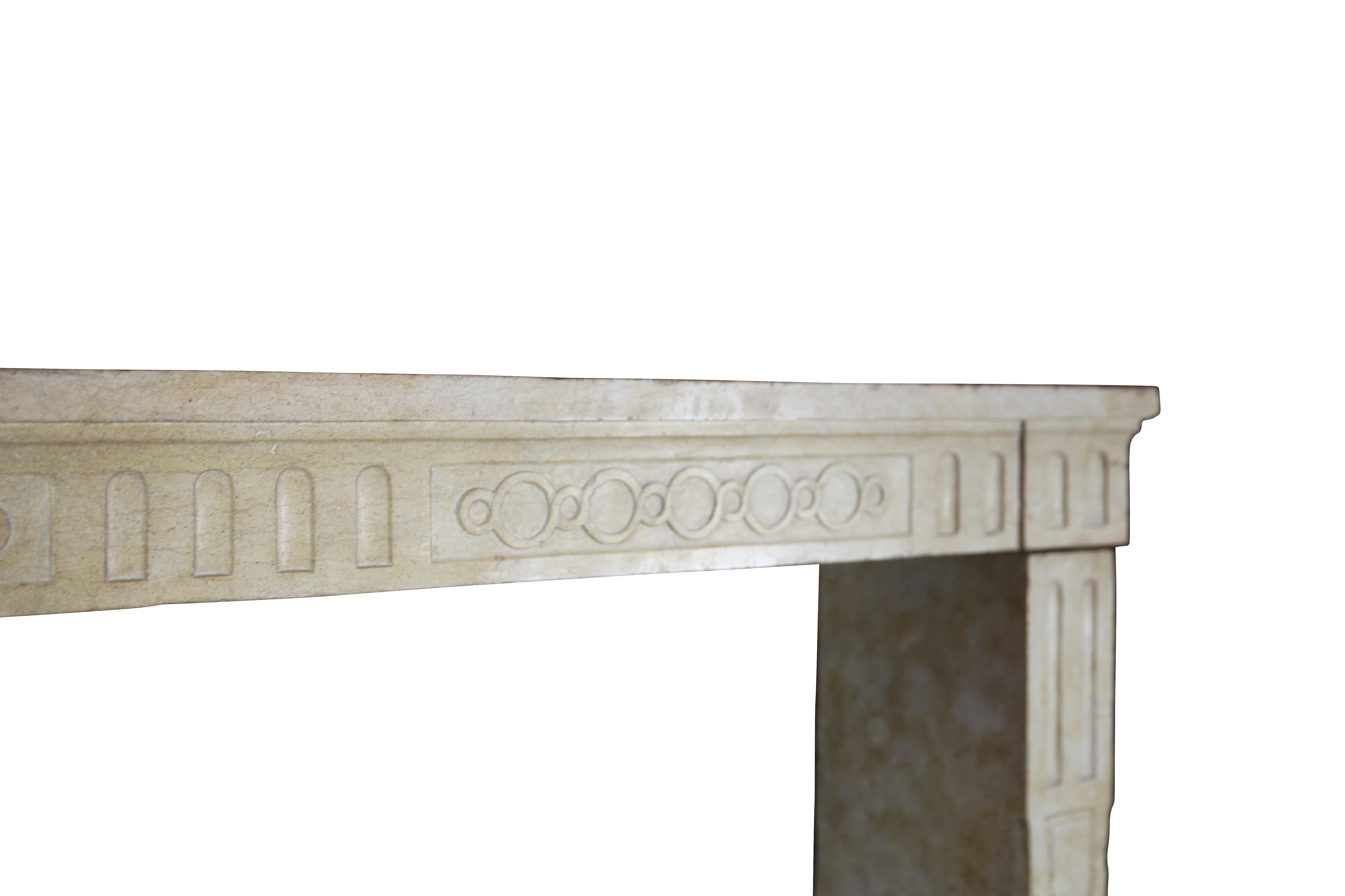 Antique French country limestone decorative fireplace surround from the Louis XVI period, 18th century. A classic architectural element for timeless interior design.
Measures: 
171 cm Exterior Width 67,32 Inch
110 cm Exterior Hight 43,31