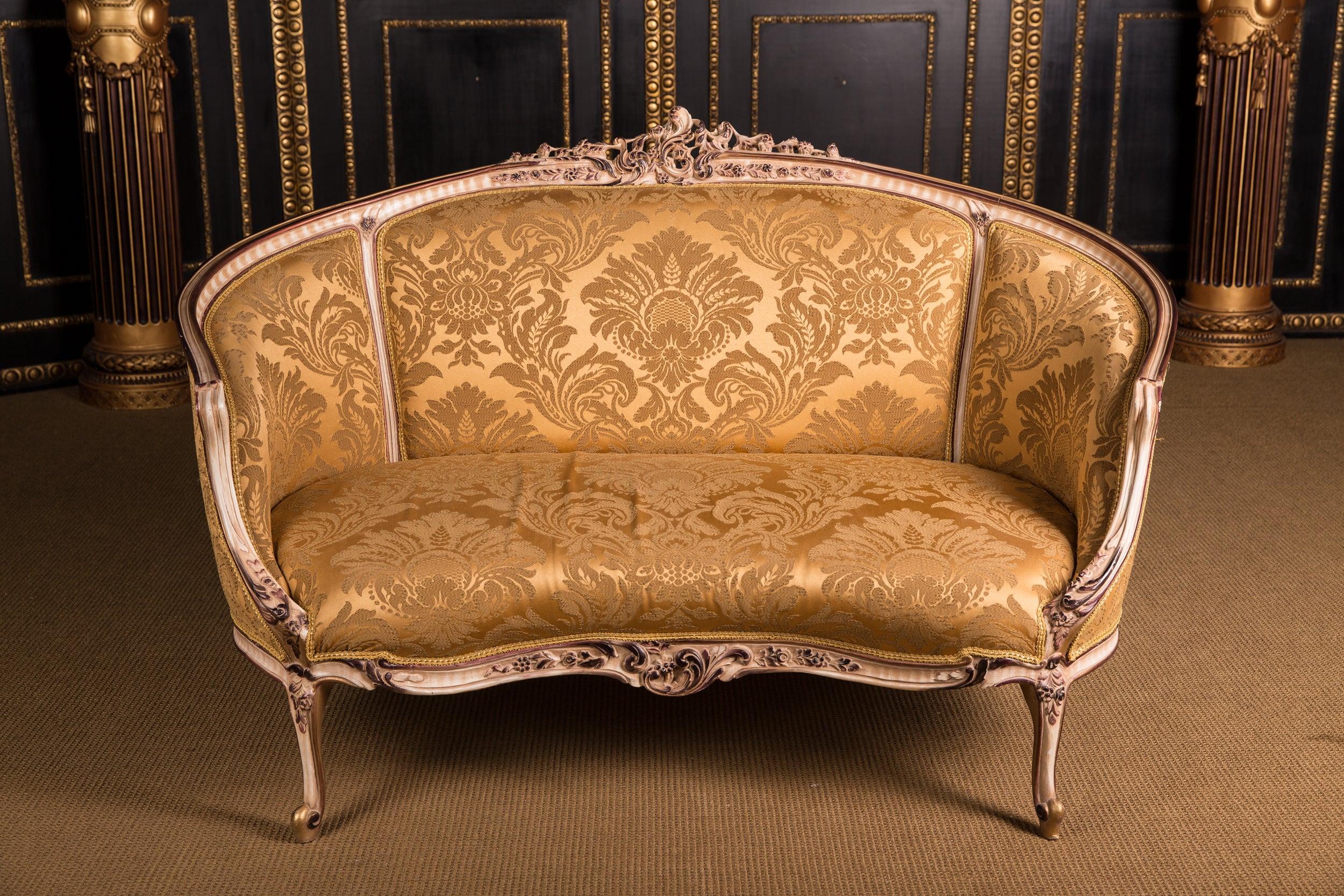 Solid beechwood, carved and painted. Semicircular rising backrest frame with openwork rocaille crowning. Appropriately curved frame with rich relief carved foliage. Slightly curved frame on curly legs. Seat and backrest are finished with a