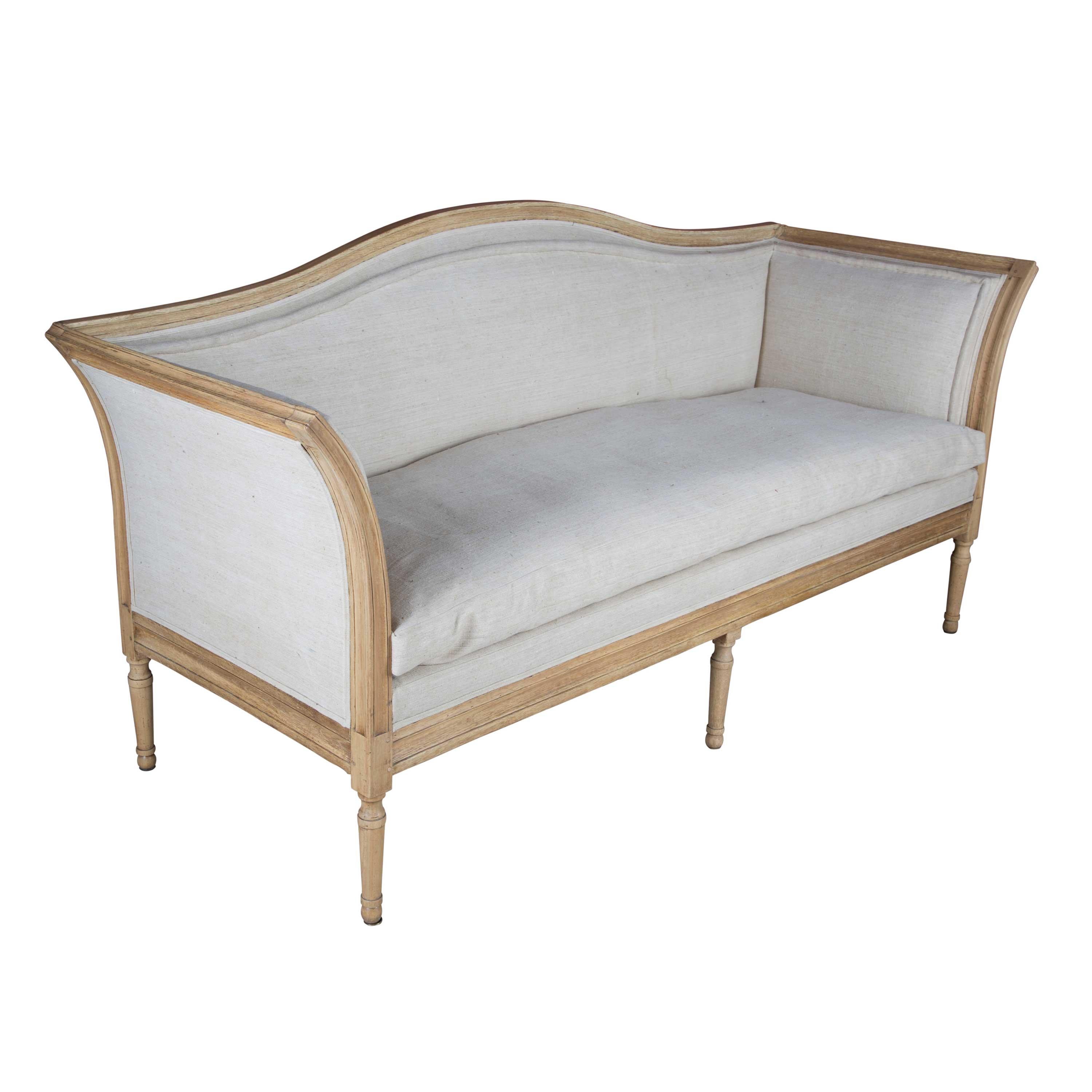 Elegant and shapely French sofa, circa 1890 with bleached frame and stunning hand stitched upholstery.