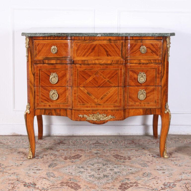 Elegant, early 20th Century French Kingwood transitional parquetry commode. Having gilt bronze hardware and mounts, inlaid on all sides. A sophisticated piece with Classic lines to suit a variety of decorative styles.