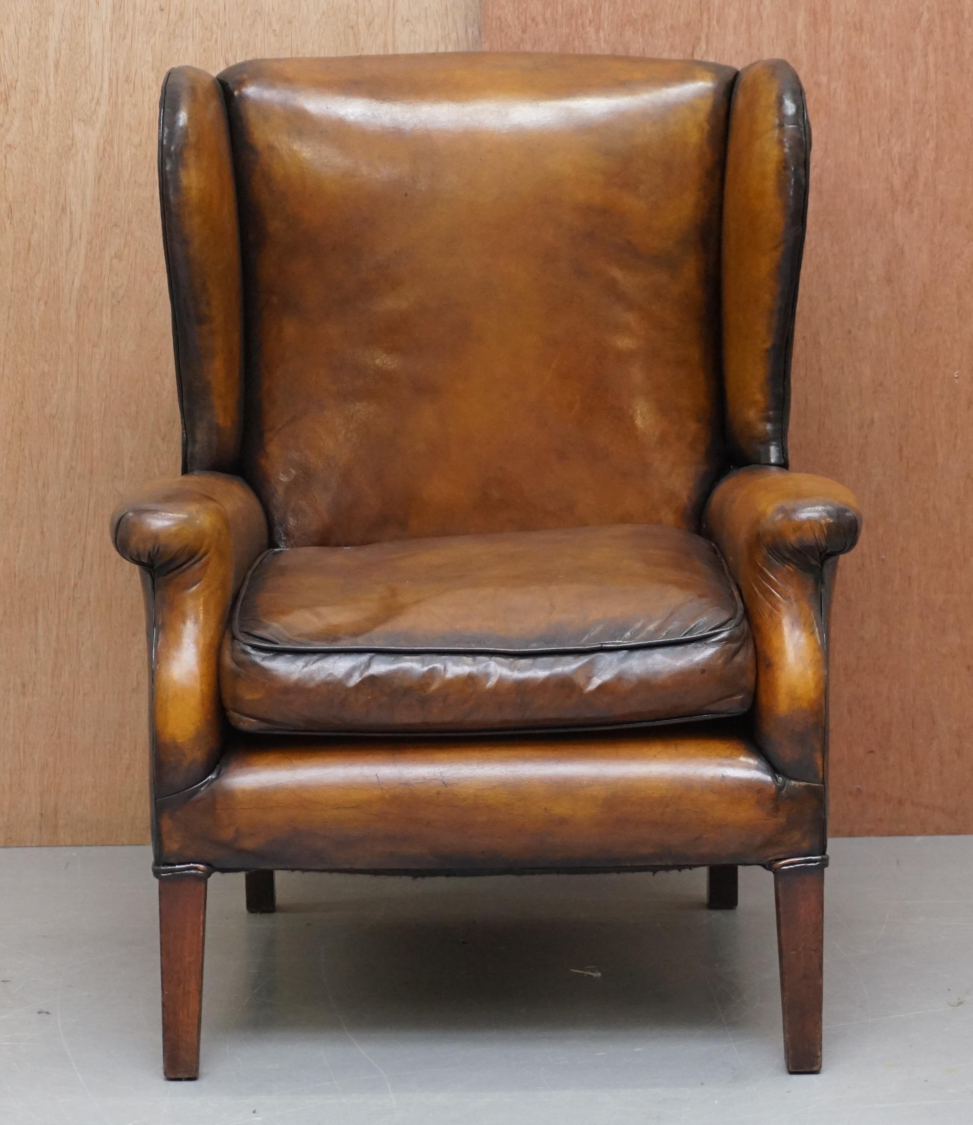We are delighted to offer for sale this stunning fully restored cigar brown hand dyed leather Edwardian wingback club armchair with nicely sculpted frame

A very good looking and nicely refurbished piece. This is an original Edwardian circa 1910