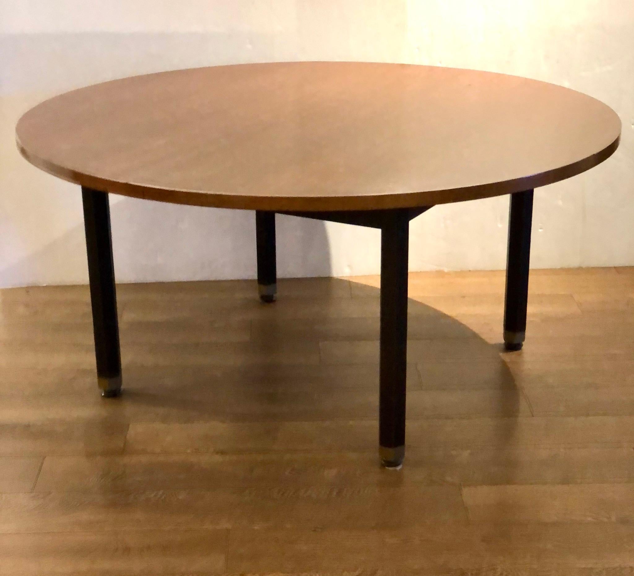 Elegant low game table in walnut top with mahogany base and brass accents feet, circa 1950s in its original finish very clean for its age has a nice look.