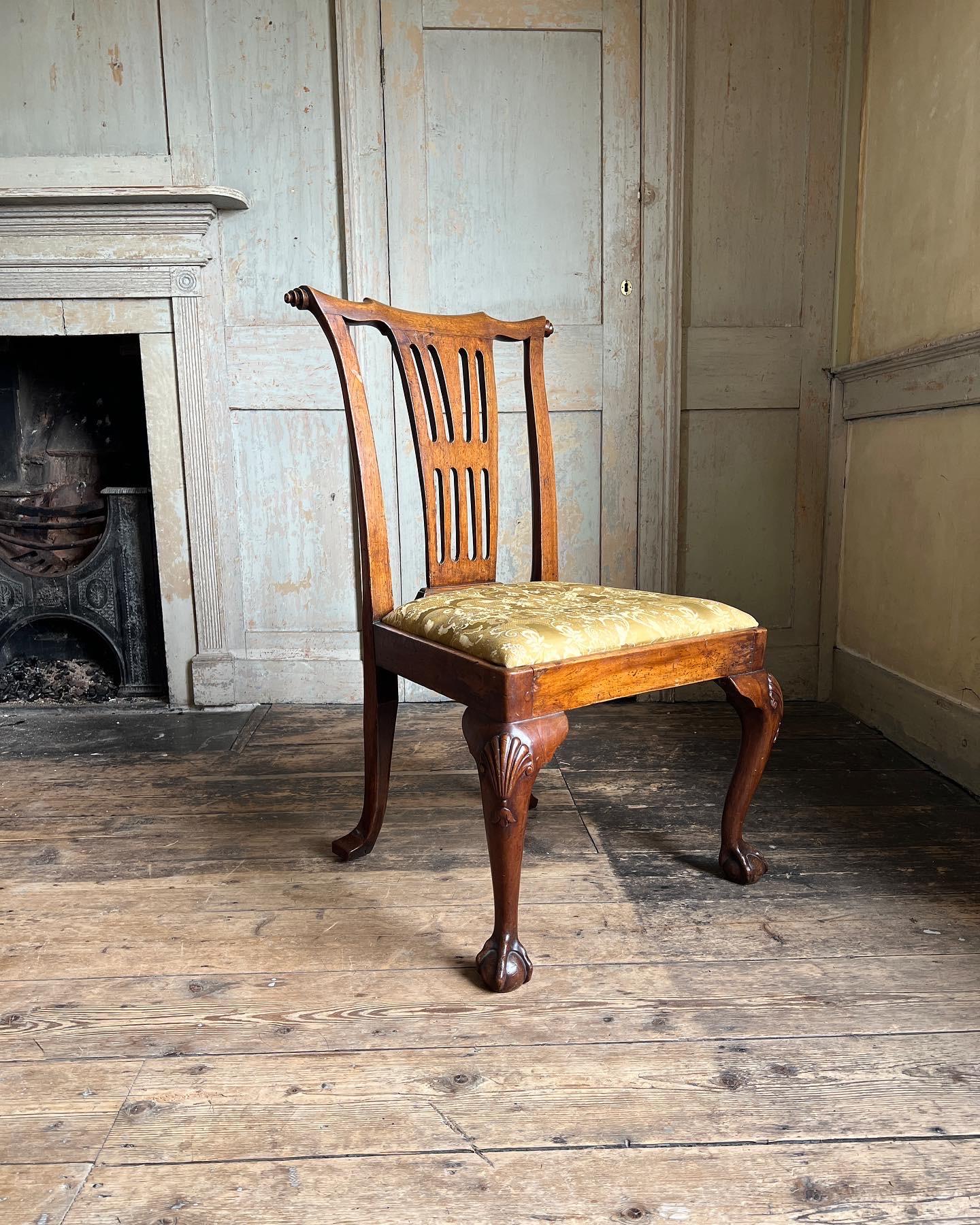An elegant George II walnut side chair with scrolled crest rail, pierced splat and shell carved cabriole legs. C.1730. Similar chair designs have been made by William Kent.

Measures - 94cm H x 56cm D x 61cm W x 44cm Seat Height.