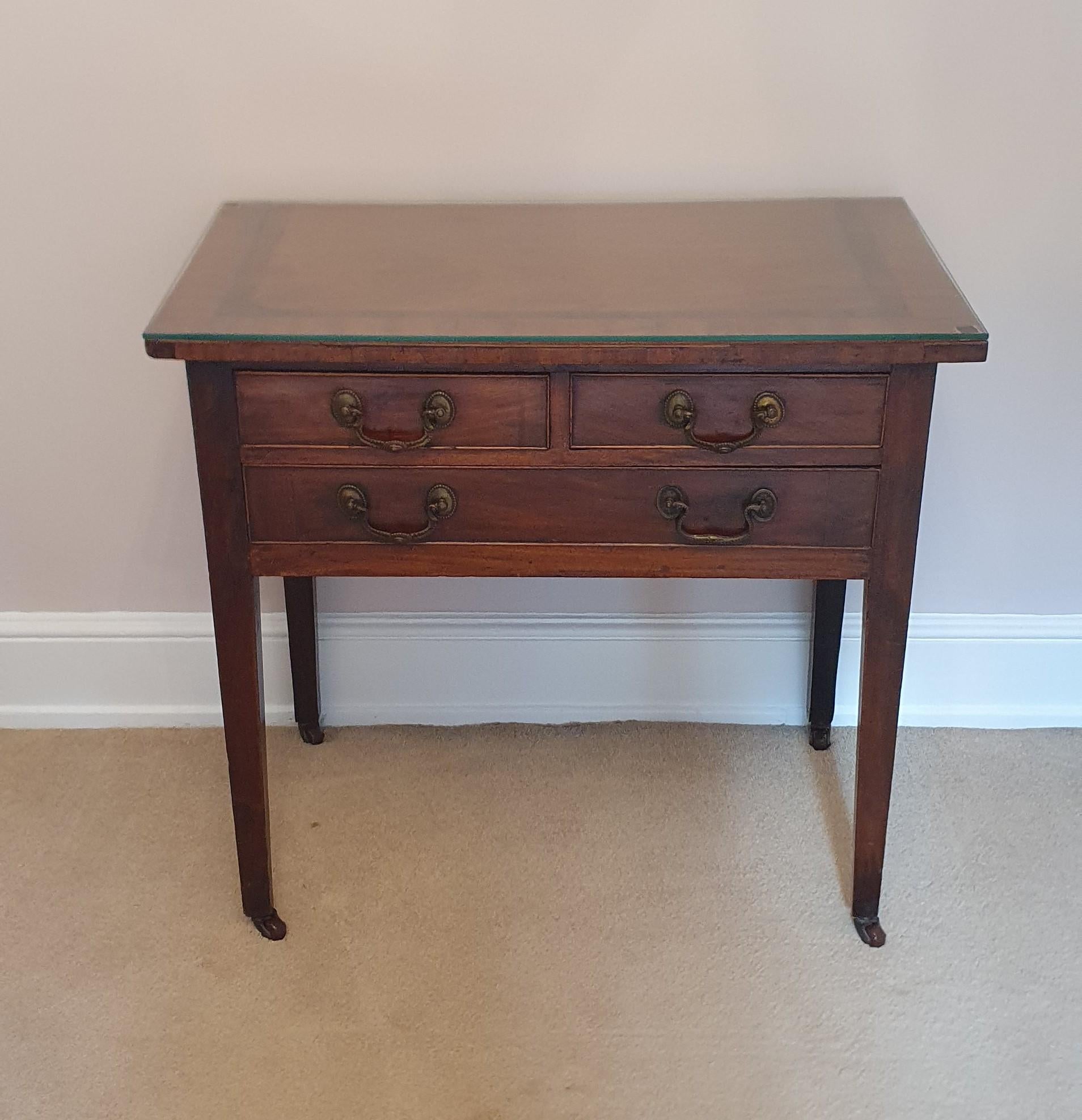 Presenting a very elegant George III style Mahogany lowboy with three drawers and a delicate marquetry Crossbanded top with inner Rosewood Band and Burr Wood Centre

The is a super useful piece of furniture which only cements its design in its 200