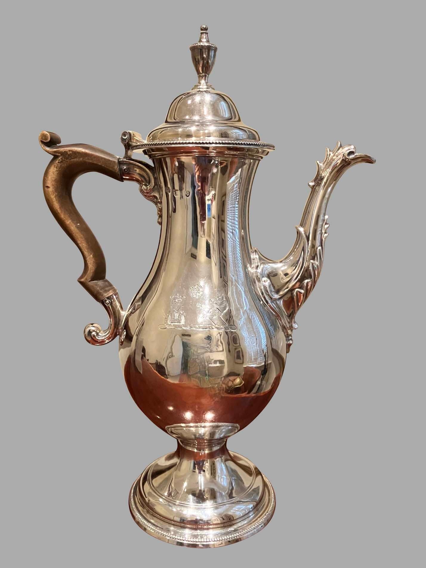 A fine English George III  sterling silver coffee pot of baluster form, made by the 