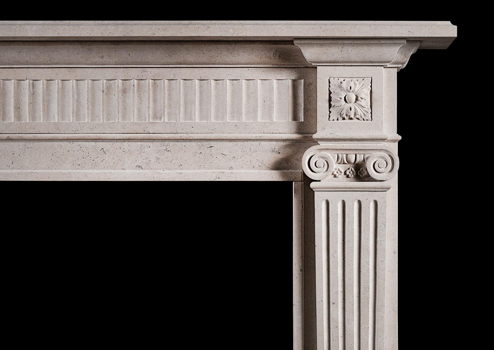 An elegant English limestone fireplace with carved Ionic capitals to fluted, tapering jambs. The fluted frieze with carved square paterae to the side blockings. A fine copy of an earlier original.
N.B. May be subject to an extended lead time, please