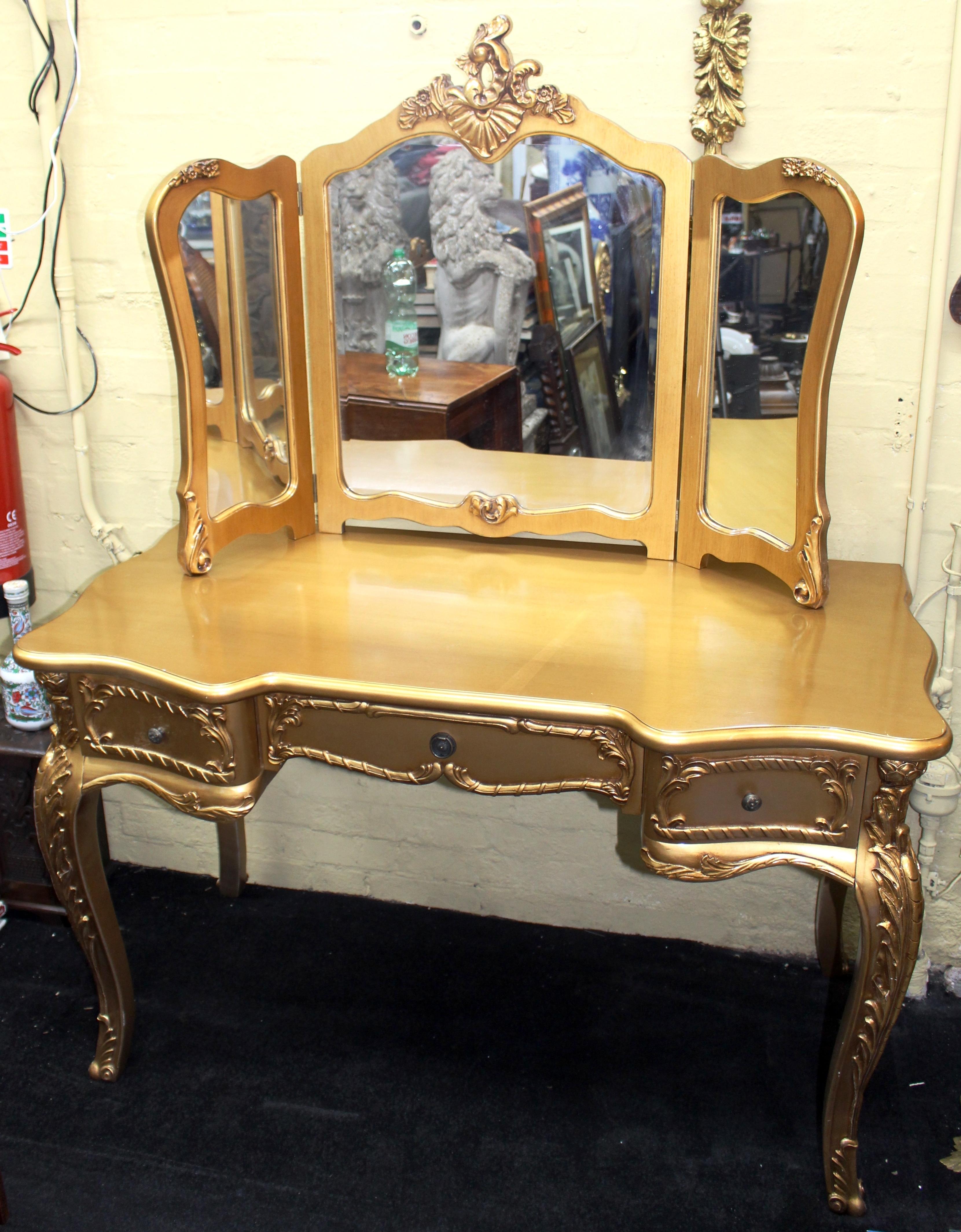 Width 119 cm 47in
Depth 61 cm 24 in
Height (to top) 155 cm 61 in
Height (to surface) 76 cm 39 3/4 in





Dressing table and mirror
Style French
Composition carved wood
Finish antiqued gilt
Condition: Very good conditon. One or two very