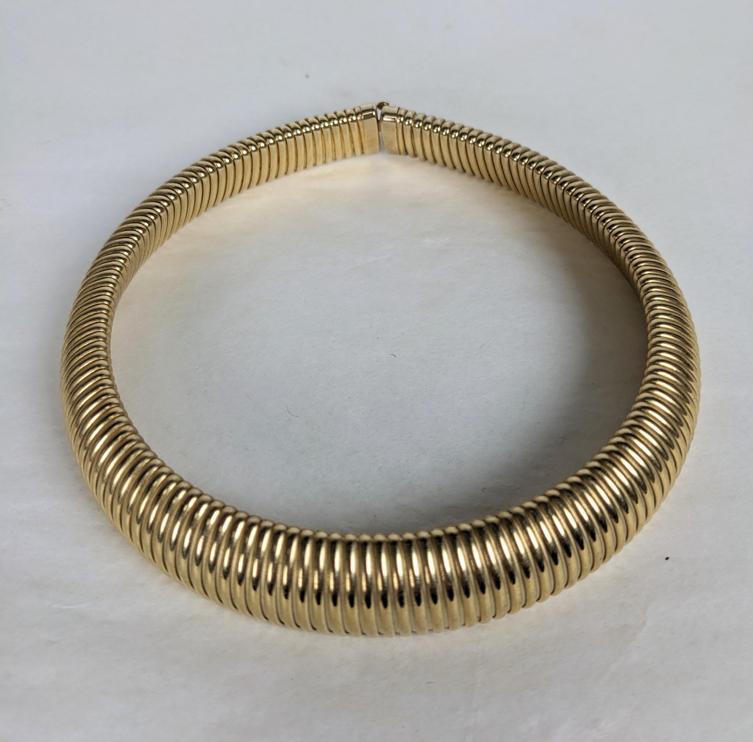 Elegant Retro Style Gilt Gas Pipe Tubular Collar from the 1980's. Slightly stretchy measuring approx 15-16 inches by 1