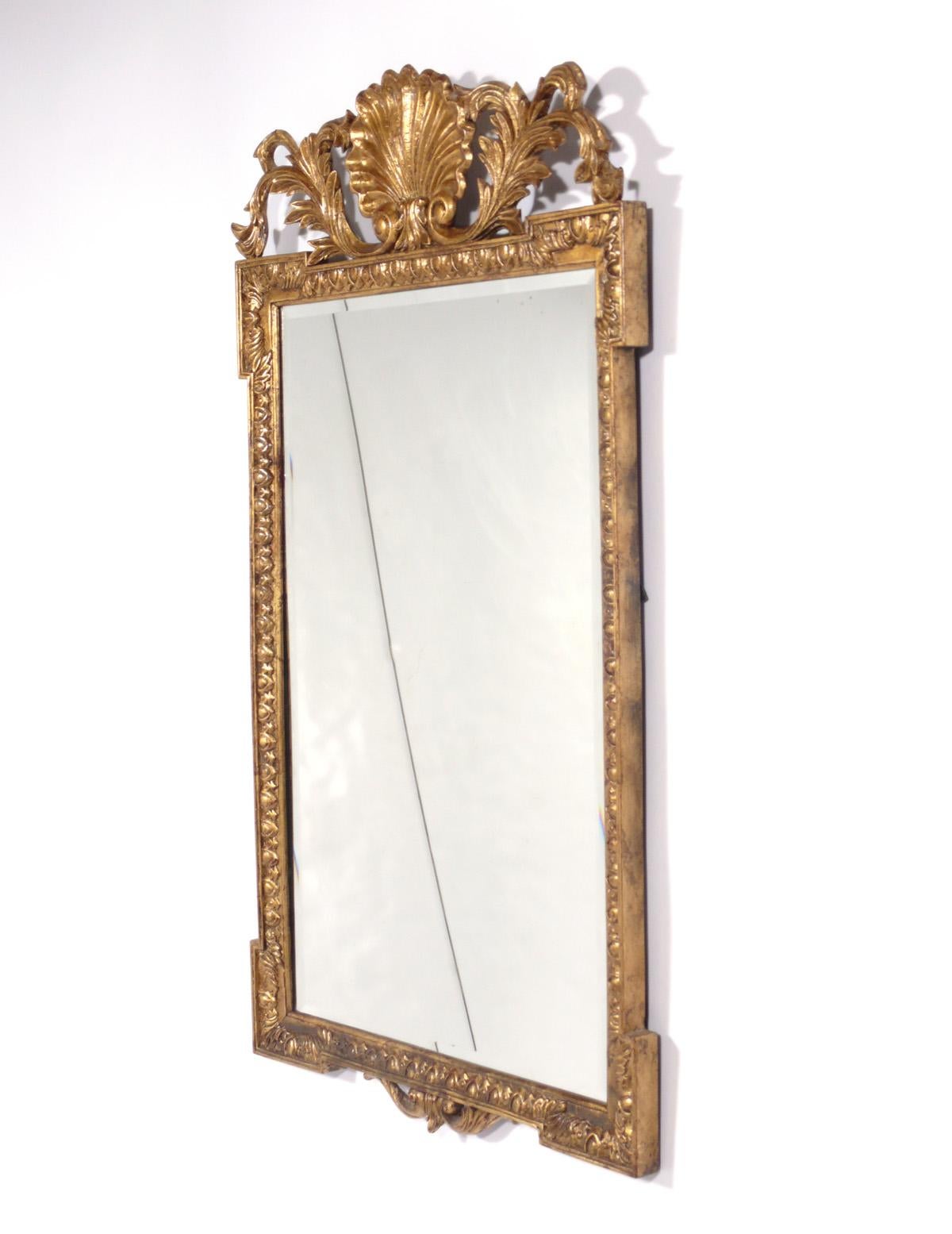 Elegant gilt mirror, by Theodore Alexander, American, circa 2000s. Retains warm original patina.
