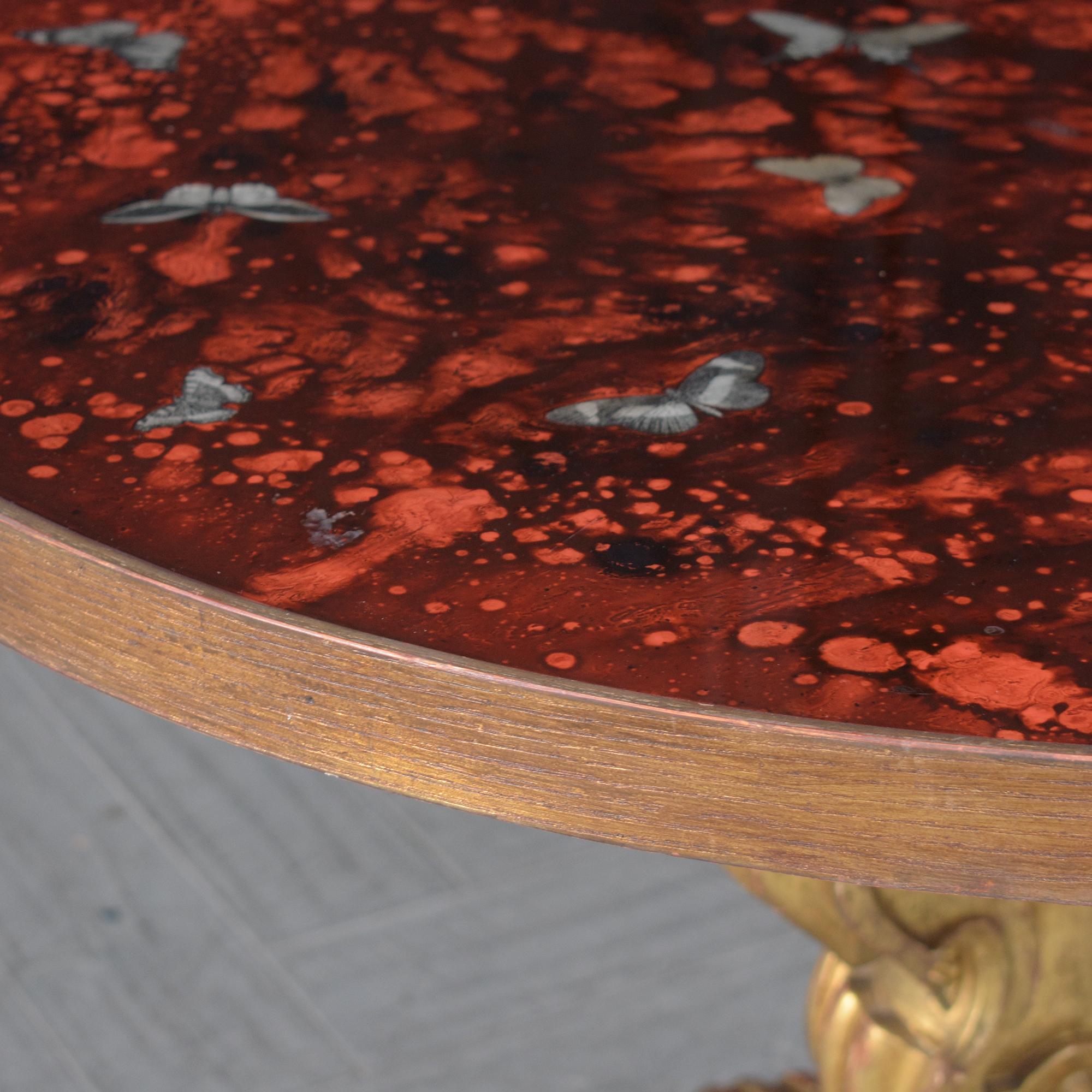 Gilt Wood Round Center Table with Butterfly Inlay: Timeless Artistry In Good Condition For Sale In Los Angeles, CA