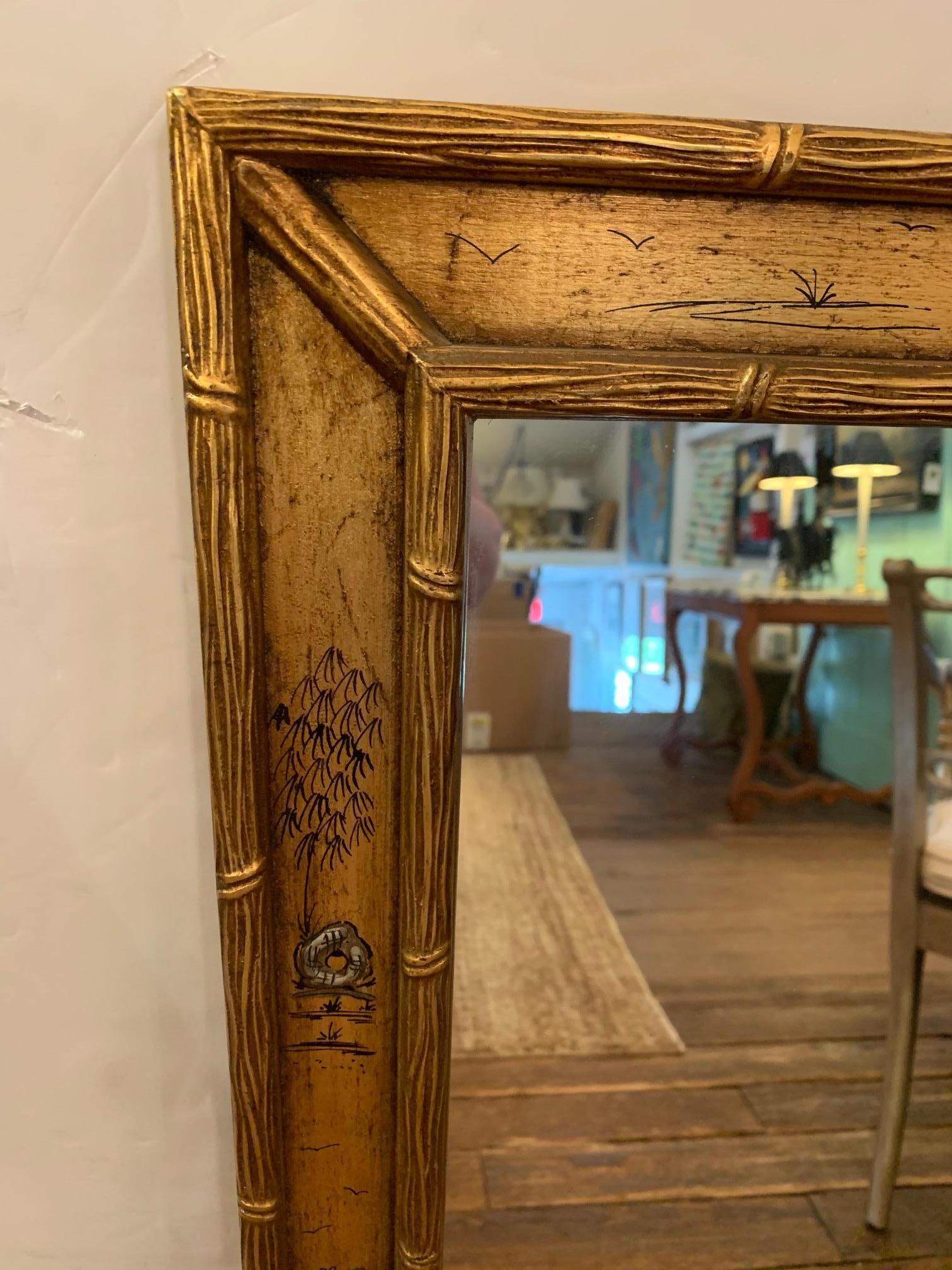 Beautiful rectangular large giltwood carved mirror having bamboo motif and lovely hand painted chinoiserie details.