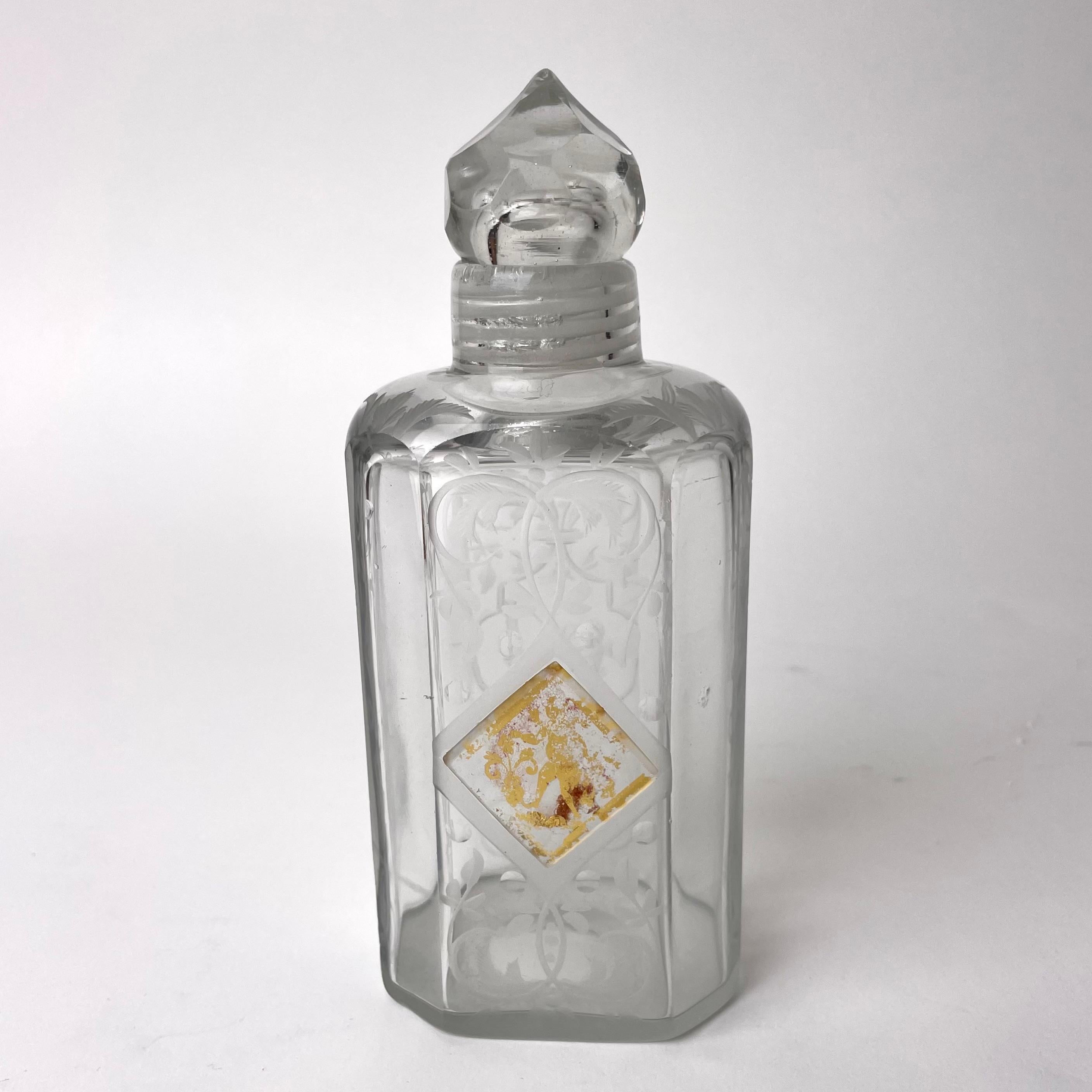 Elegant Glass Bottle with glass screw cap (unusual) probably from the 18th Century. Beautiful engraved with a gilt center sektion on one side. Wear on the guilding (se pictures)

Wear consistent with age and use 