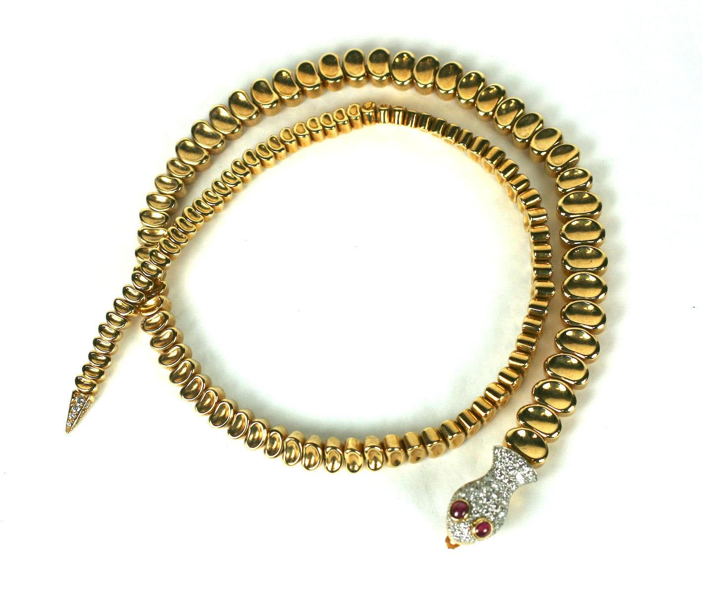 This elegant Gold and Diamond Snake Necklace was a custom designed and ordered piece from the 1970's. The body construction is very similar to the Elsa Peretti's articulated snake belts/necklaces for Tiffany, but, the owner has added a diamond and