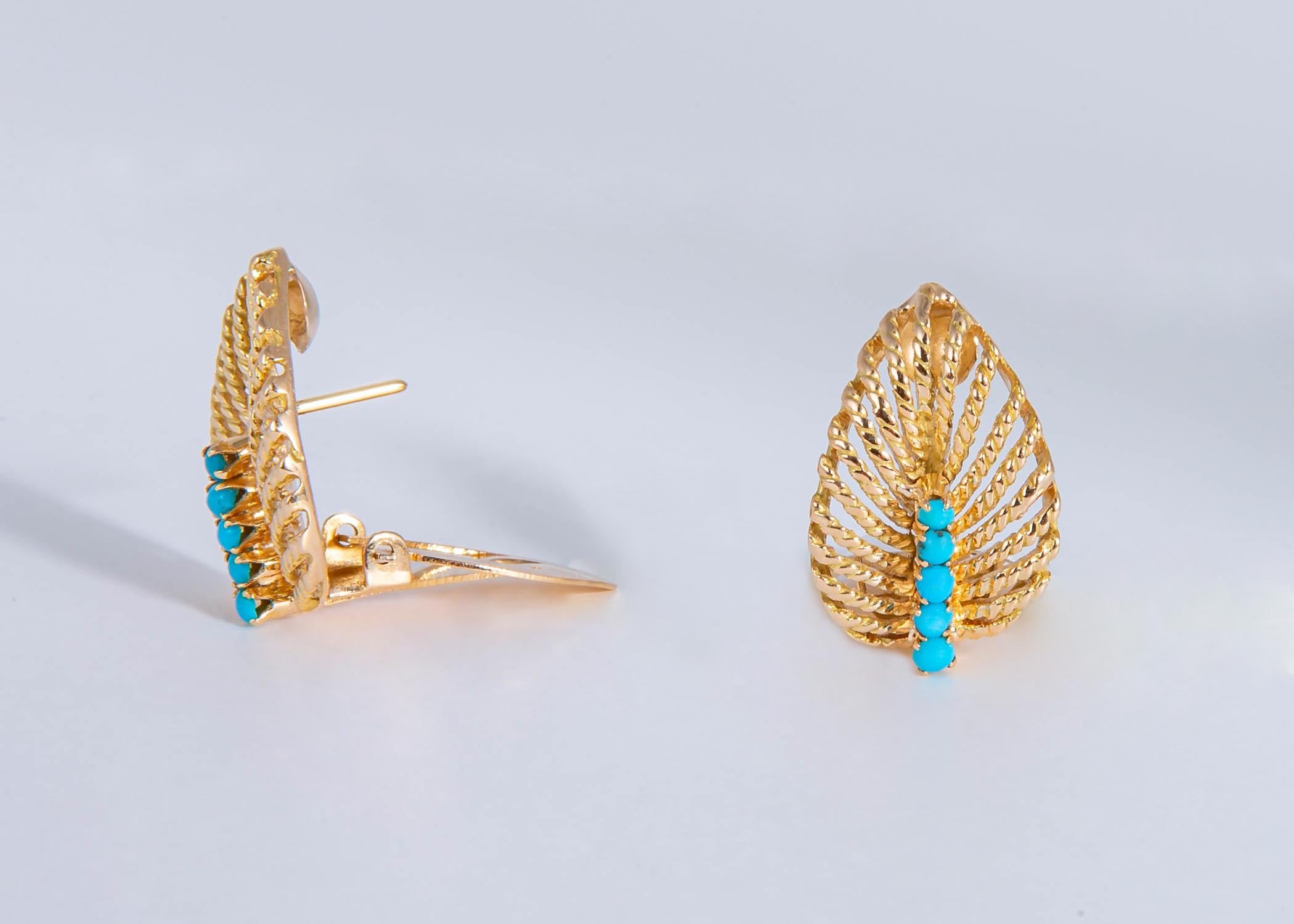 Rich 18k gold is beautifully detailed into an open work leaf design and accented with vivid turquoise.  7/8's of an inch in length.