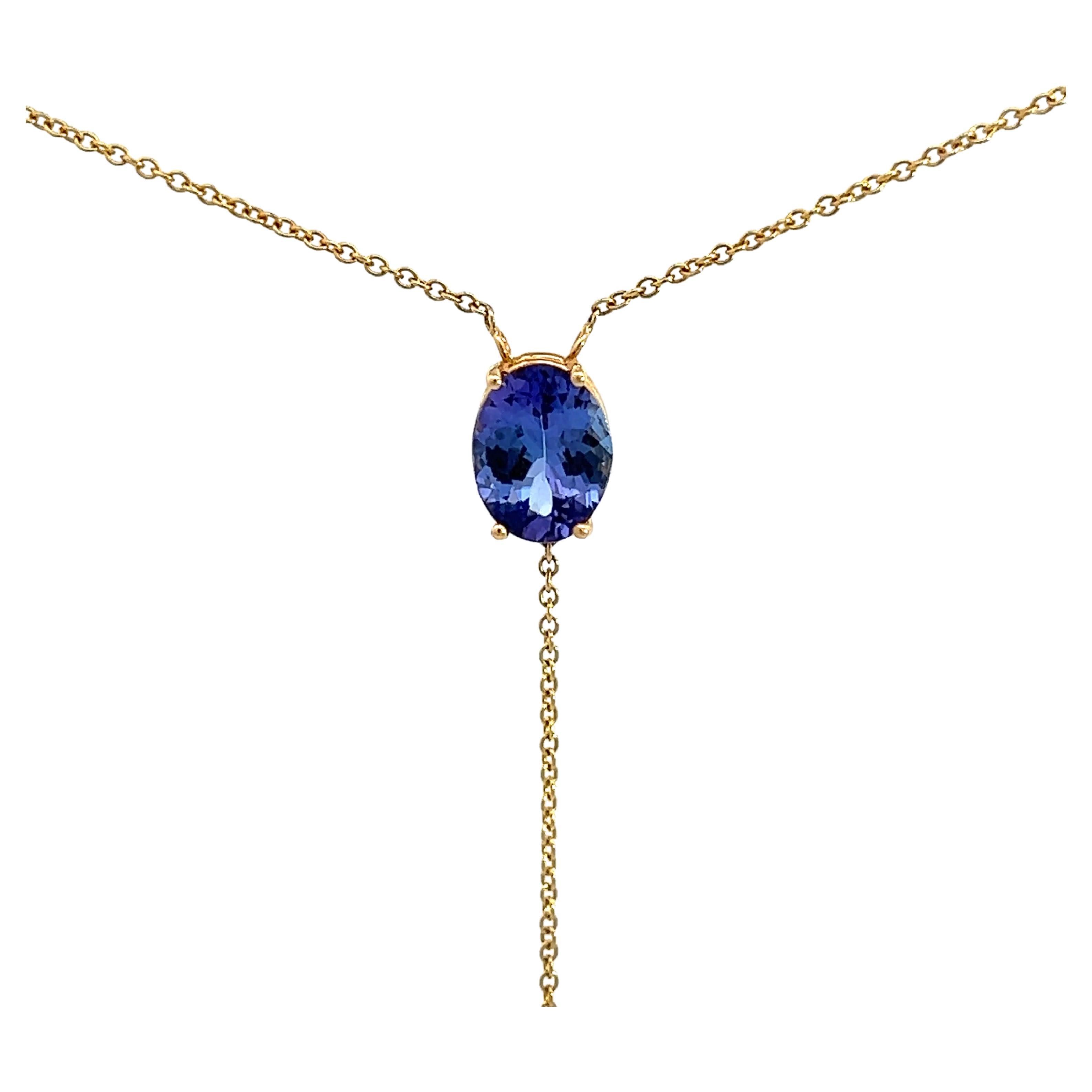 Elegante ciondolo in oro con gemma blu