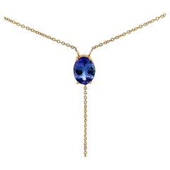 Elegante ciondolo in oro con gemma blu