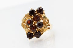 Élégante bague vintage plaquée or avec grenats