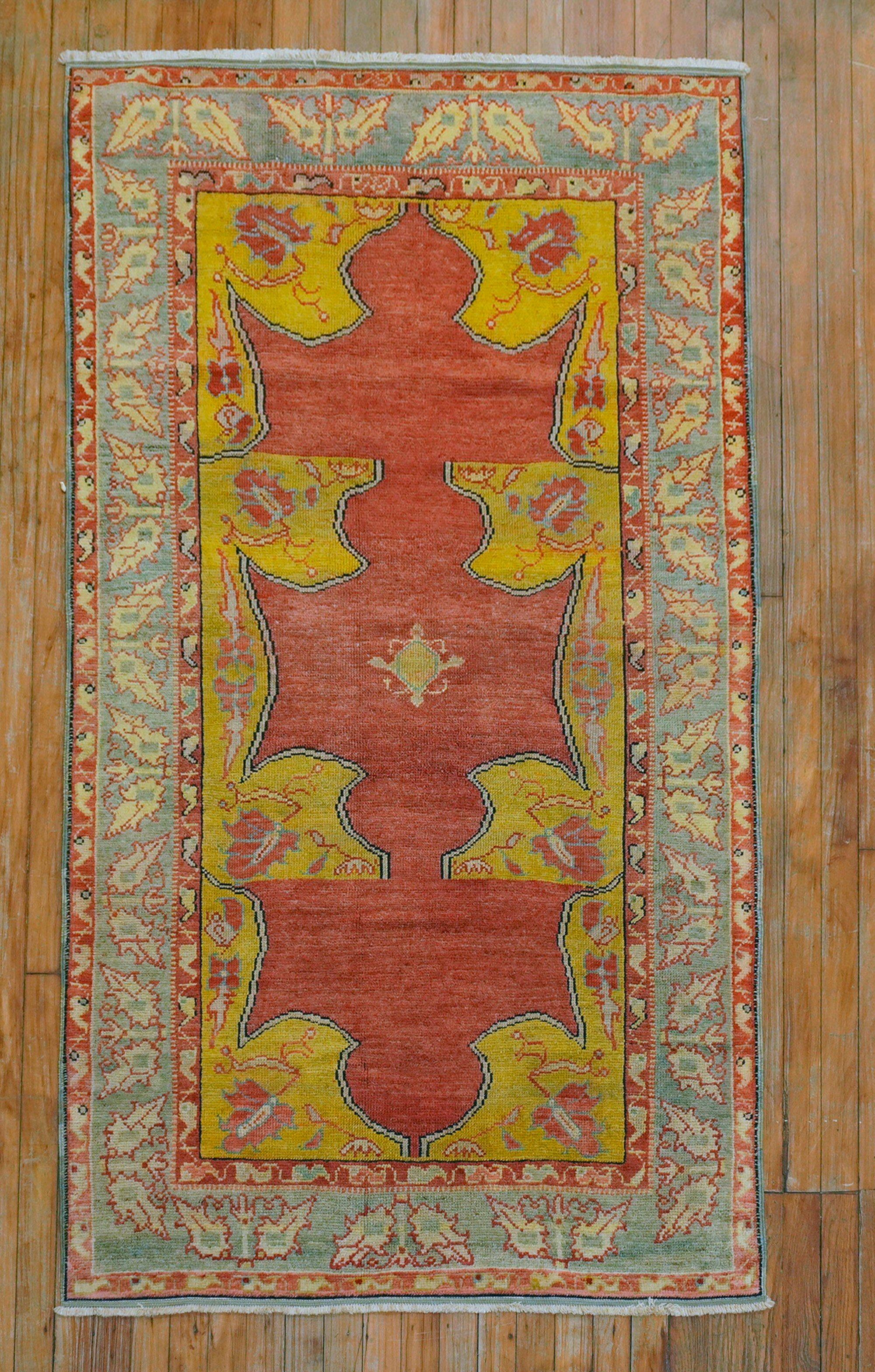 An early 20gh century Turkish Rug in dominant accents in yellow and red

Measures: 3'6'' x 6'3''.