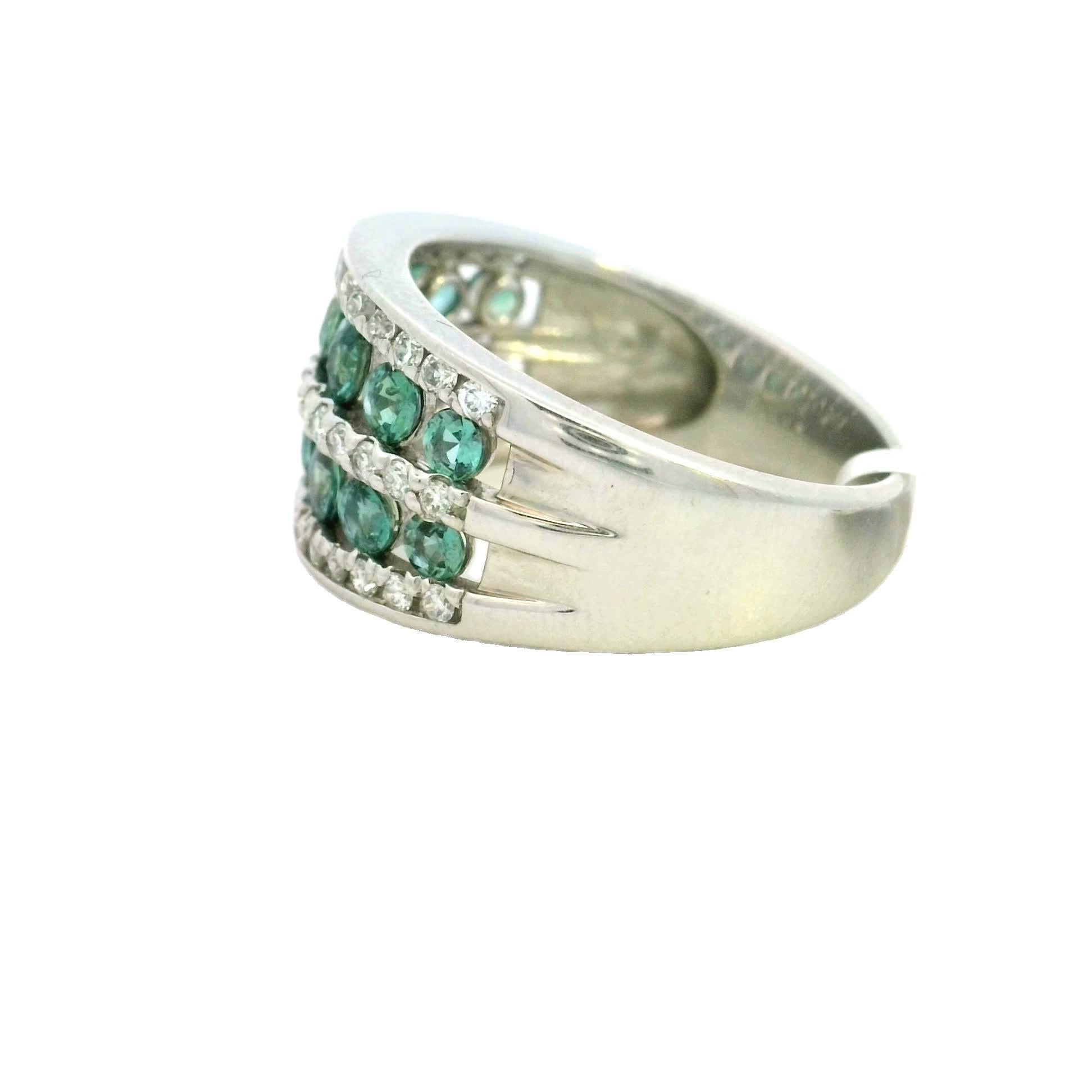 Discover the allure of this stunning green gemstone ring, designed to captivate and charm. With its intricate band adorned with sparkling stones, it adds a touch of elegance to any outfit. Perfect for special occasions or everyday wear, this ring is