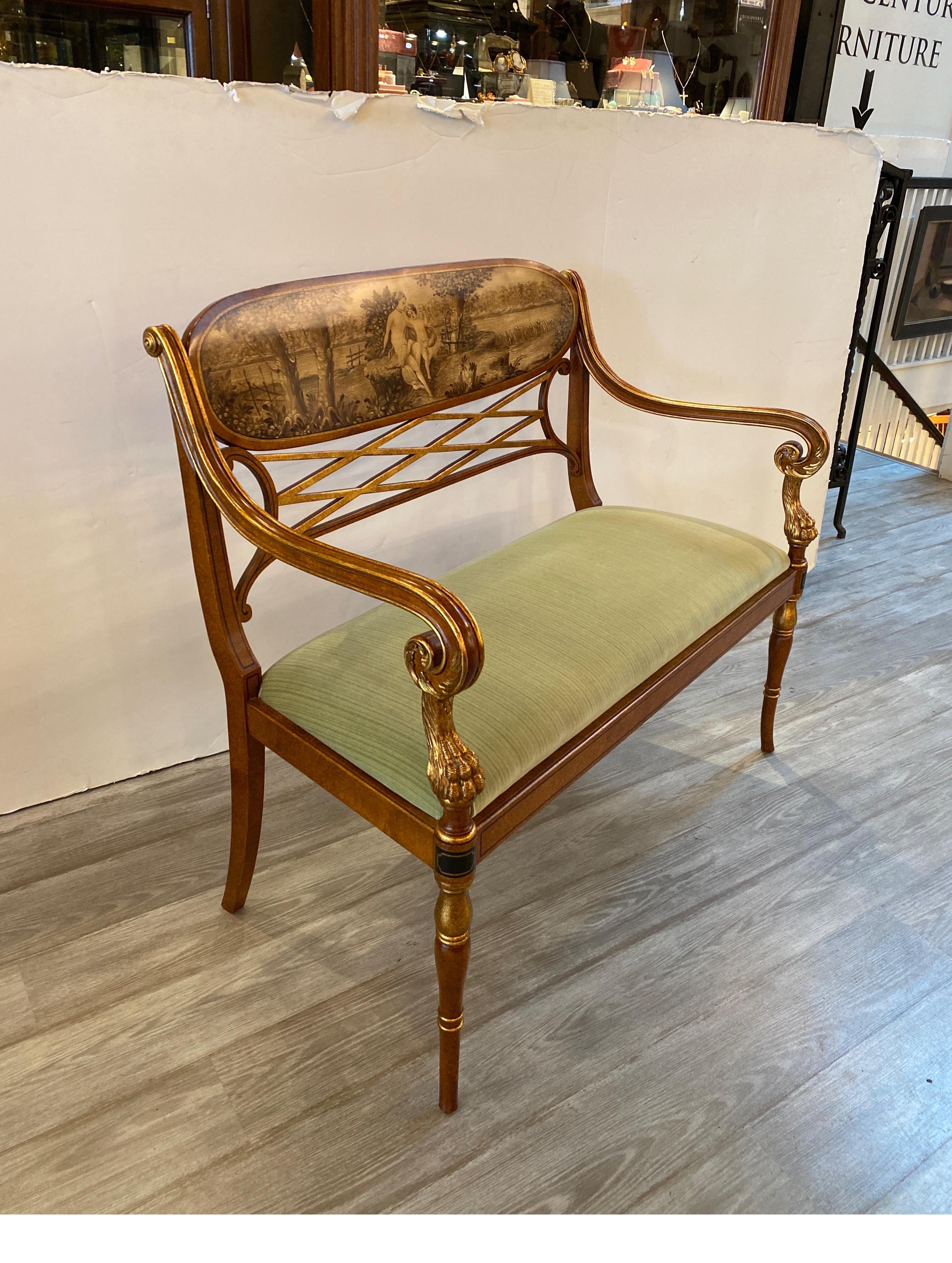 Beautiful hand crafted double seat settee by Galimberti Lino, Italy. The finish is a hand stippled almost tortoise finish on walnut with a cartouche of toile style hand painted scene of mother and child. The seat is a soft high quality light sage