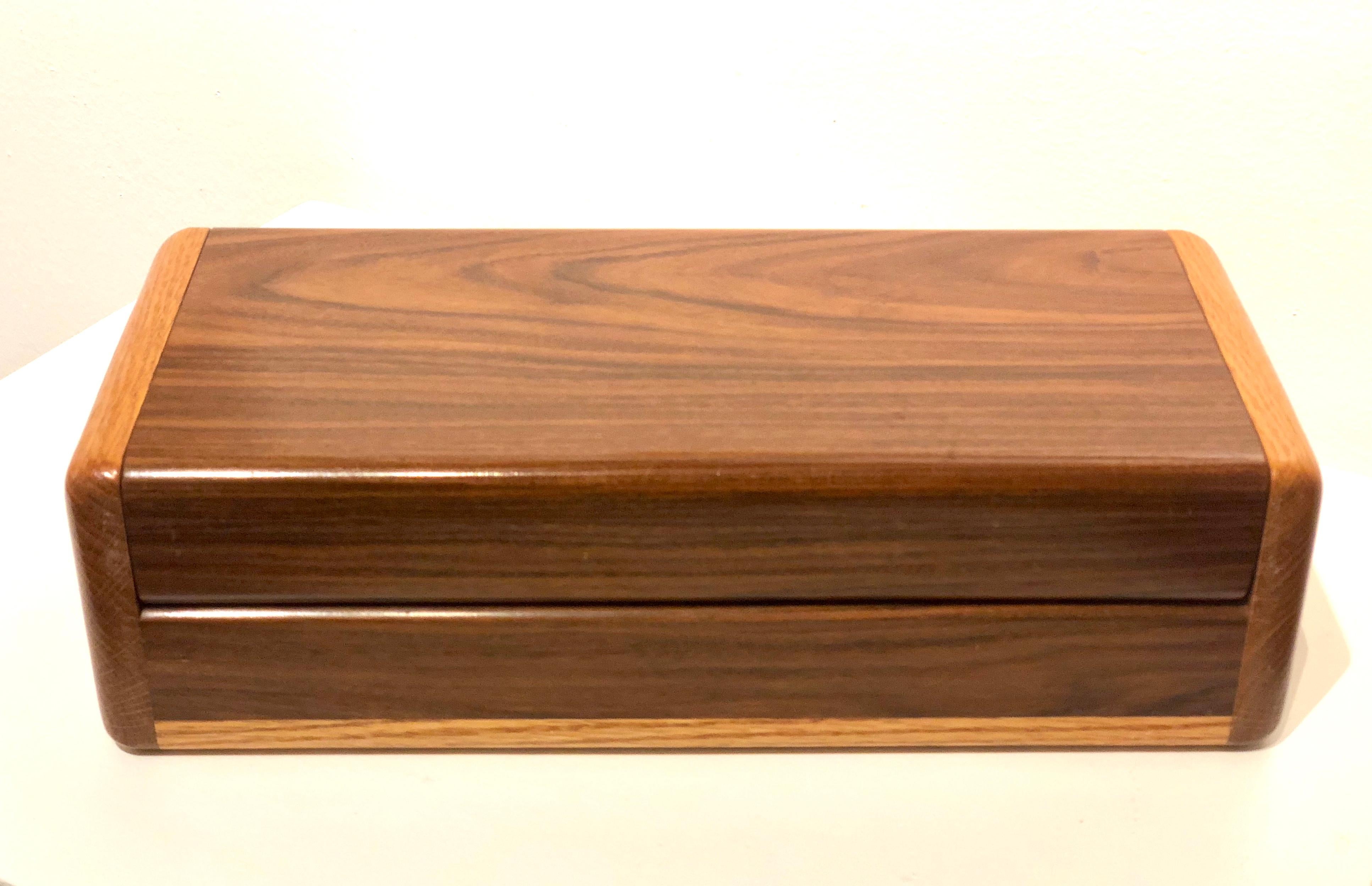 A unique walnut jewelry box piece handcrafted, well done piece solid walnut and oak nice removable tray.