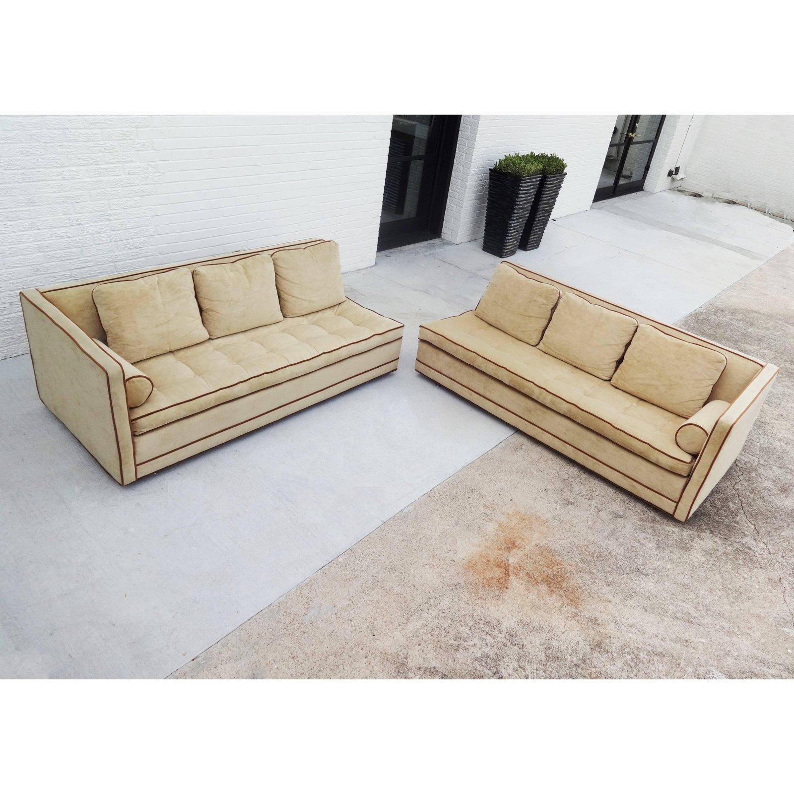 A well-tailored, nicely proportioned and architecturally clean-looking design this two-piece sectional sofa by Harvey Probber. With even arms, tufted seat cushions and six loose cushions on the back. Hidden wood legs add minimalism. Professionally