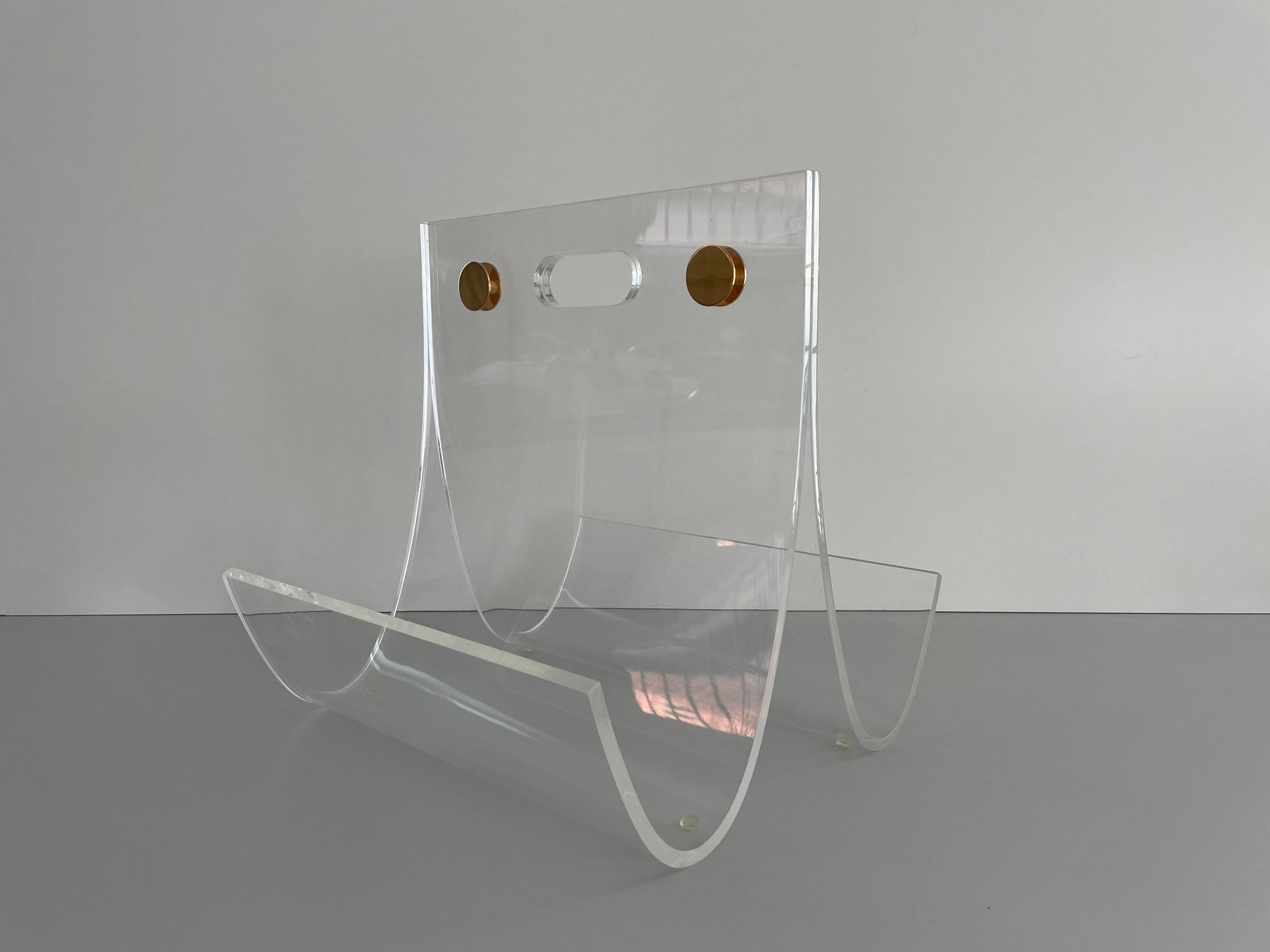 Elegant Heavy Thick Lucite Plexiglass Magazine Rack, 1970s, Germany

It is very ideal and suitable for all living areas.

No damage, no crack.
Wear consistent with age and use.

Measurements: 
Height: 41 cm
Width: 39 cm
Depth: 40 cm
