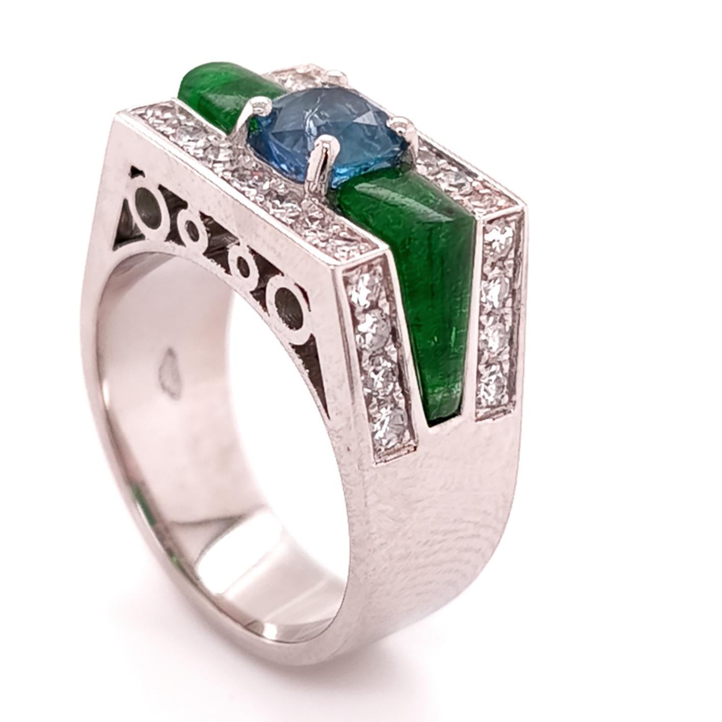 950‰ Platinum ring with a rare IGI certified Kashmir Sapphire weighing 1.33 ct natural untreated, two hand carved elements in Panjshir emerald weighing 2.60 ct, 30 natural white diamond weighing approximately 0.85 ct. The ring features the Italian