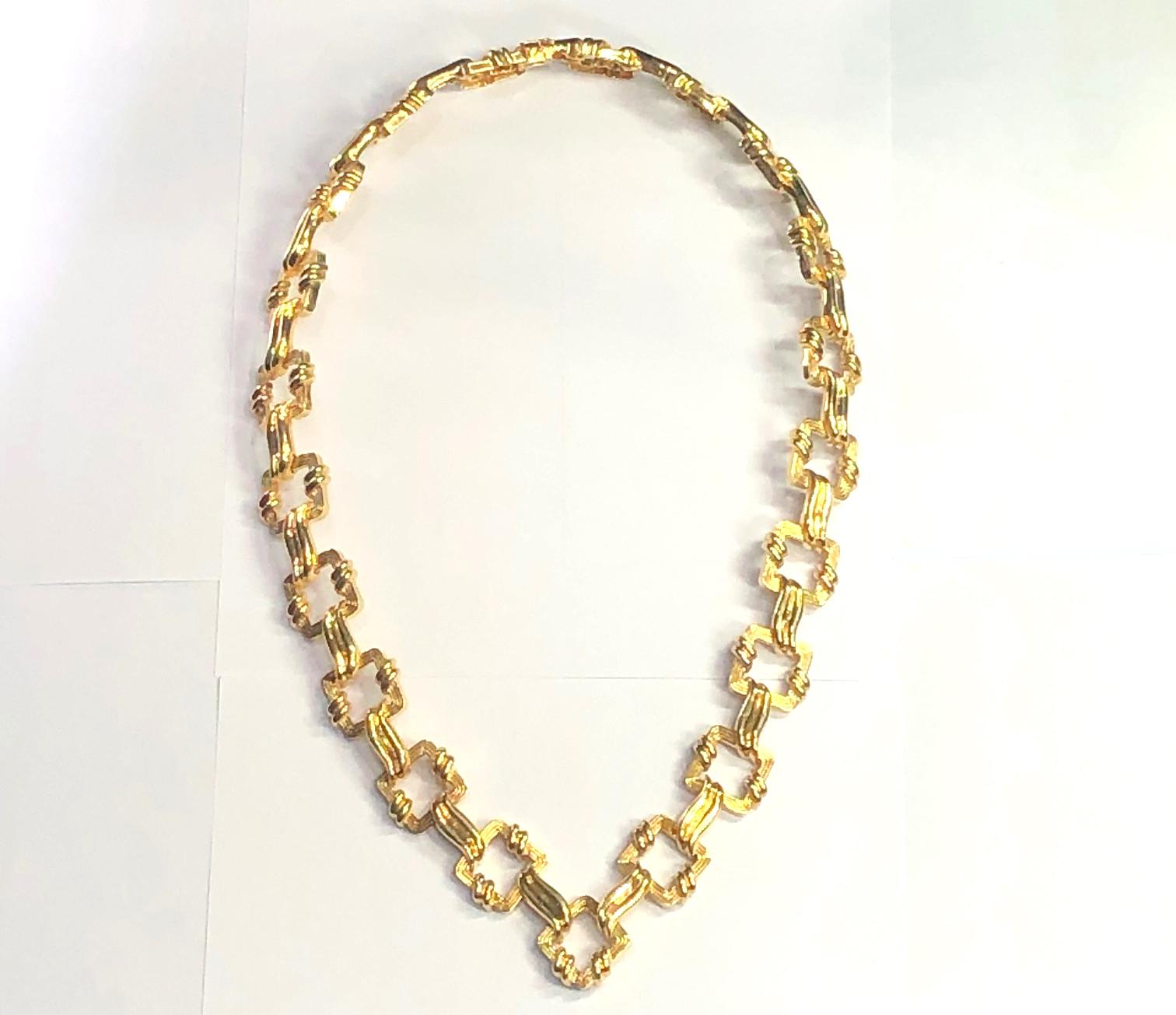 Fashioned from 10 Troy Ounces of 18k yellow gold, this very large scale Tiffany & Co. necklace is a major gold masterwork created by that venerable firm in the late twentieth century.  The necklace is 28 inches in length without the pendant which