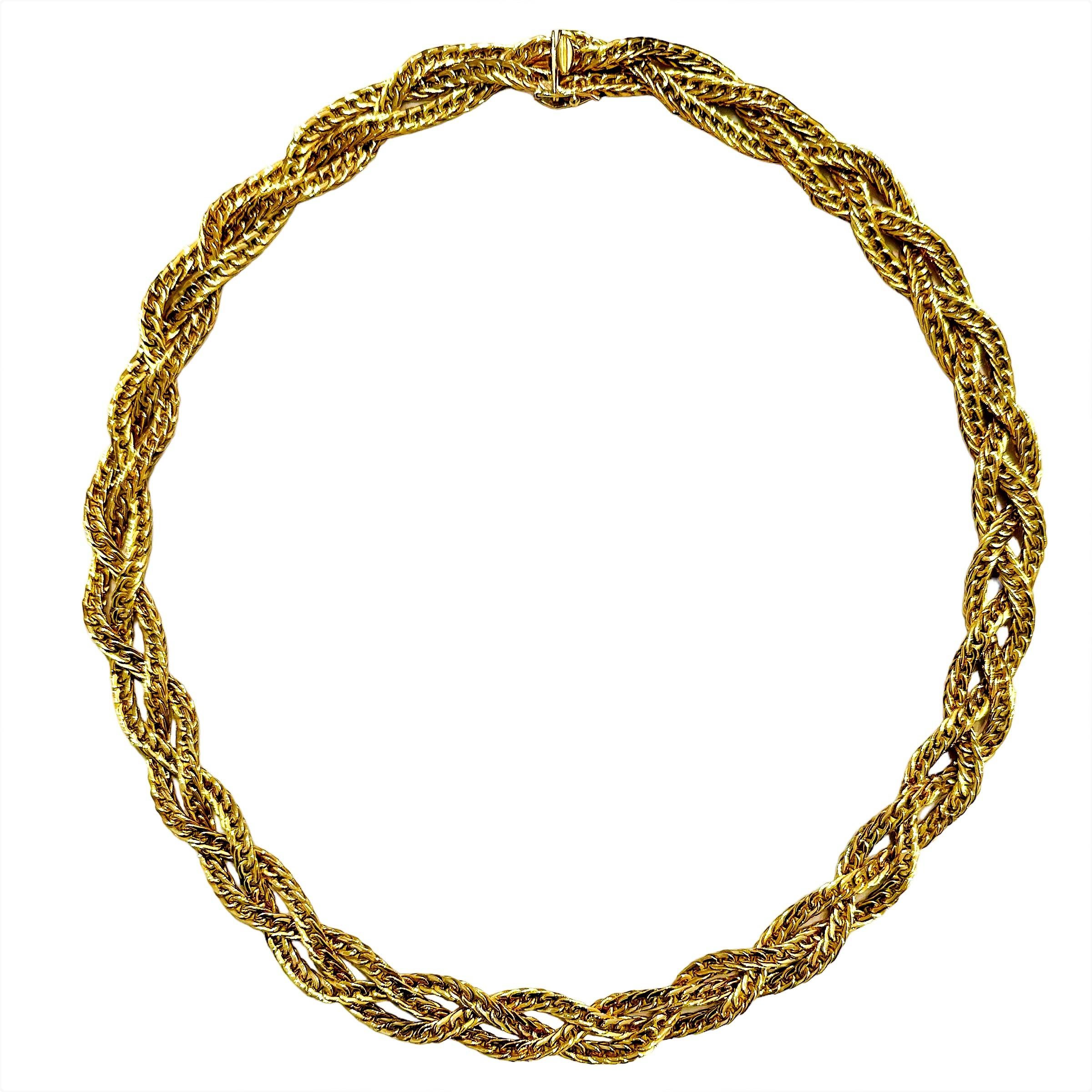 This elegant three strand 18K yellow gold braided vintage necklace was imagined and created in Torino Italy at some time during the mid-20th century. It often seems that only Italian goldsmiths are capable of this very high level of design