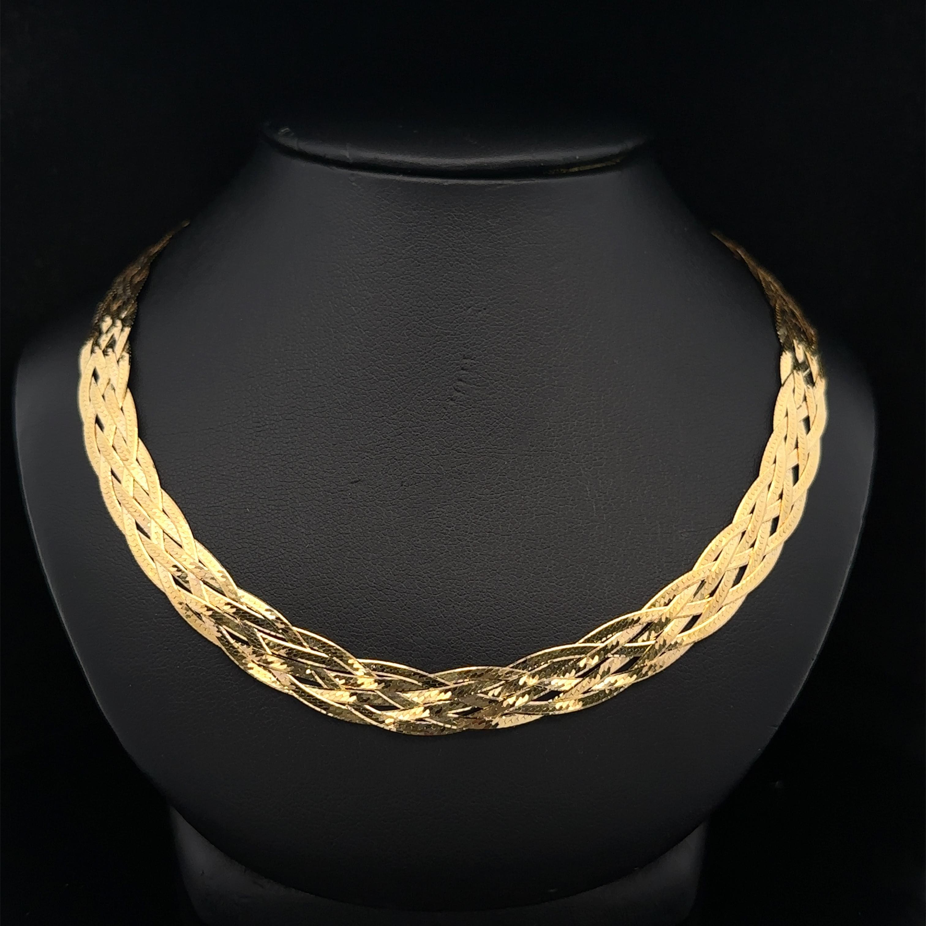 Material: Solid 18k Yellow Gold
Weight: 17.12 Grams
Chain Type: Braided Flat Herringbone link
Chain Length: 18 inches
Chain Width: 7.7mm (approx.)
Closure: Lobster Claw Clasp
Condition: Shows some light wear. Original finish & patina. Excellent