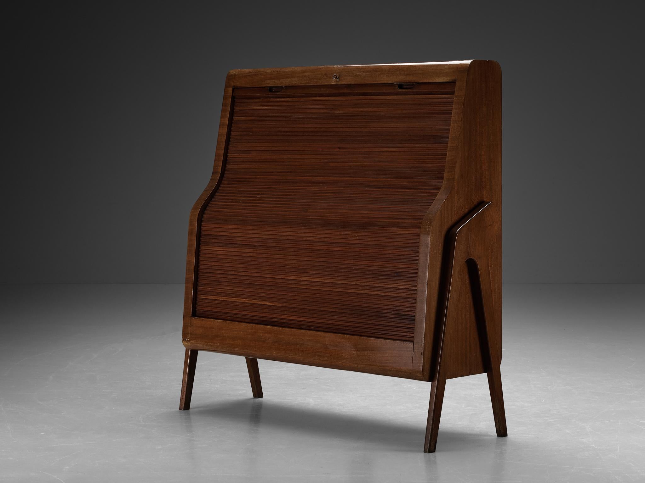 Bar cabinet, mahogany, glass, acrylic, Italy, 1950s

A gracious bar cabinet hailing from Italy and dating back to the mid-century period. The design features a tambour rolled-door that can be moved all the way down, revealing a sophisticated