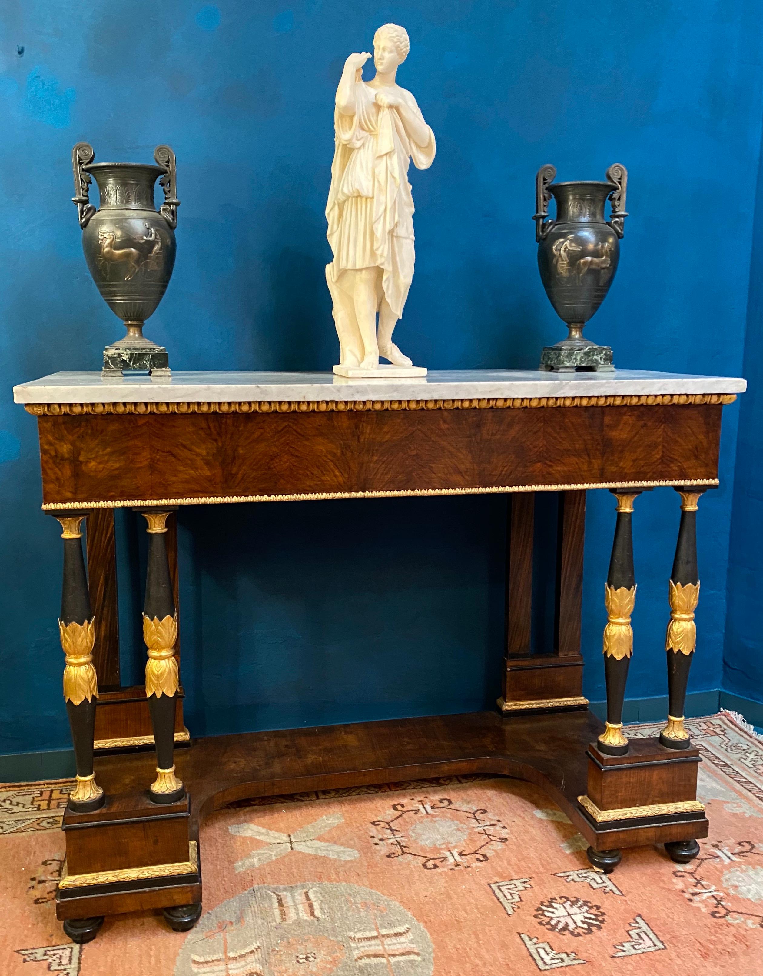 Empire mahogany and finely carved gilt-wood consoles tables with the rectangular Carrara white marble top.
Timeless elegance for your interior.
Measures: Height cm 102 width cm 124, depth 67 cm.
Similar Roman Empire console table in Palazzo Corsini