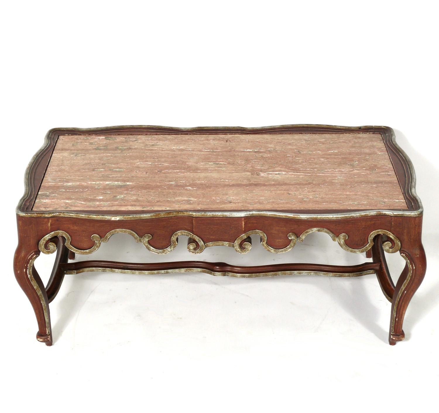 Elegant Italian marble-top coffee table, imported for Baker, circa 1950s. Hand carved wood frame finished in a deep Chinese red color, with silver leaf trim.