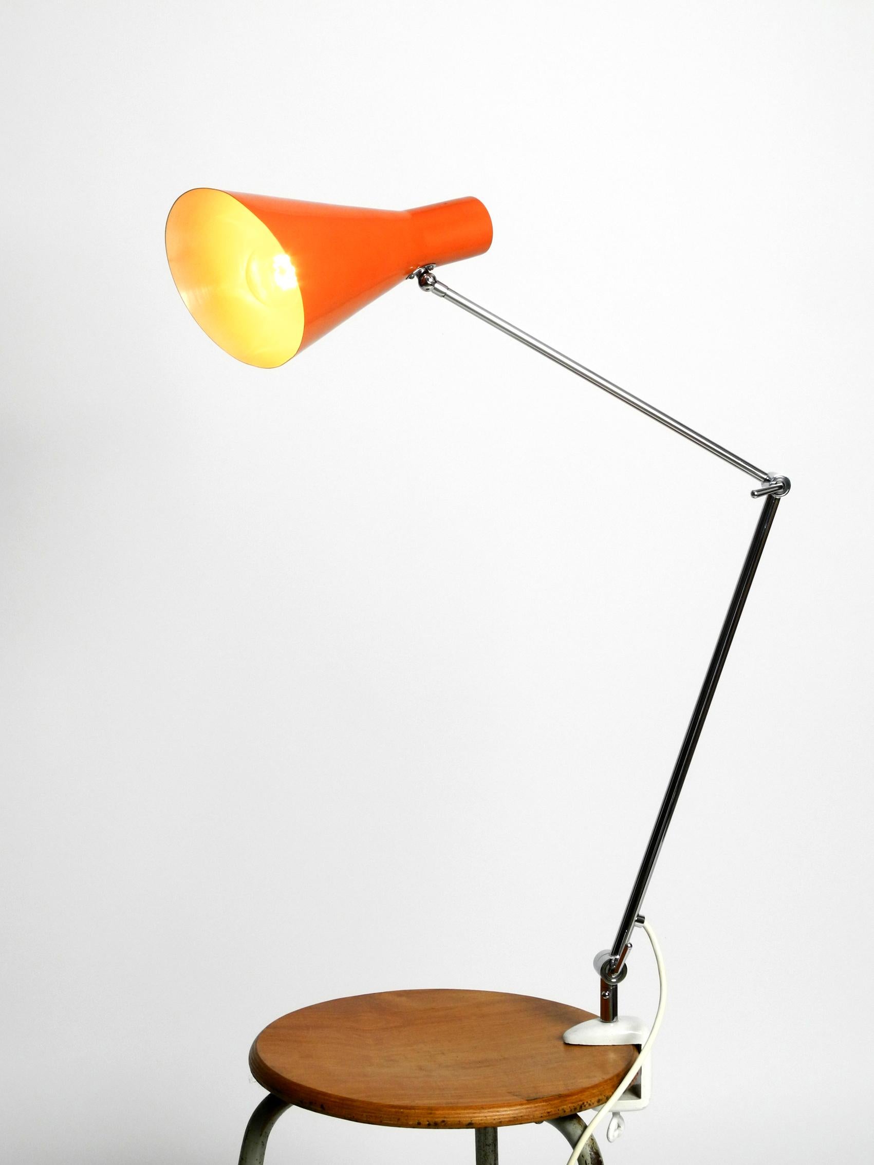 Mid-20th Century Elegant Italian Mid-Century Modern Brass Joint Clamp Lamp with Red Cone Shade For Sale