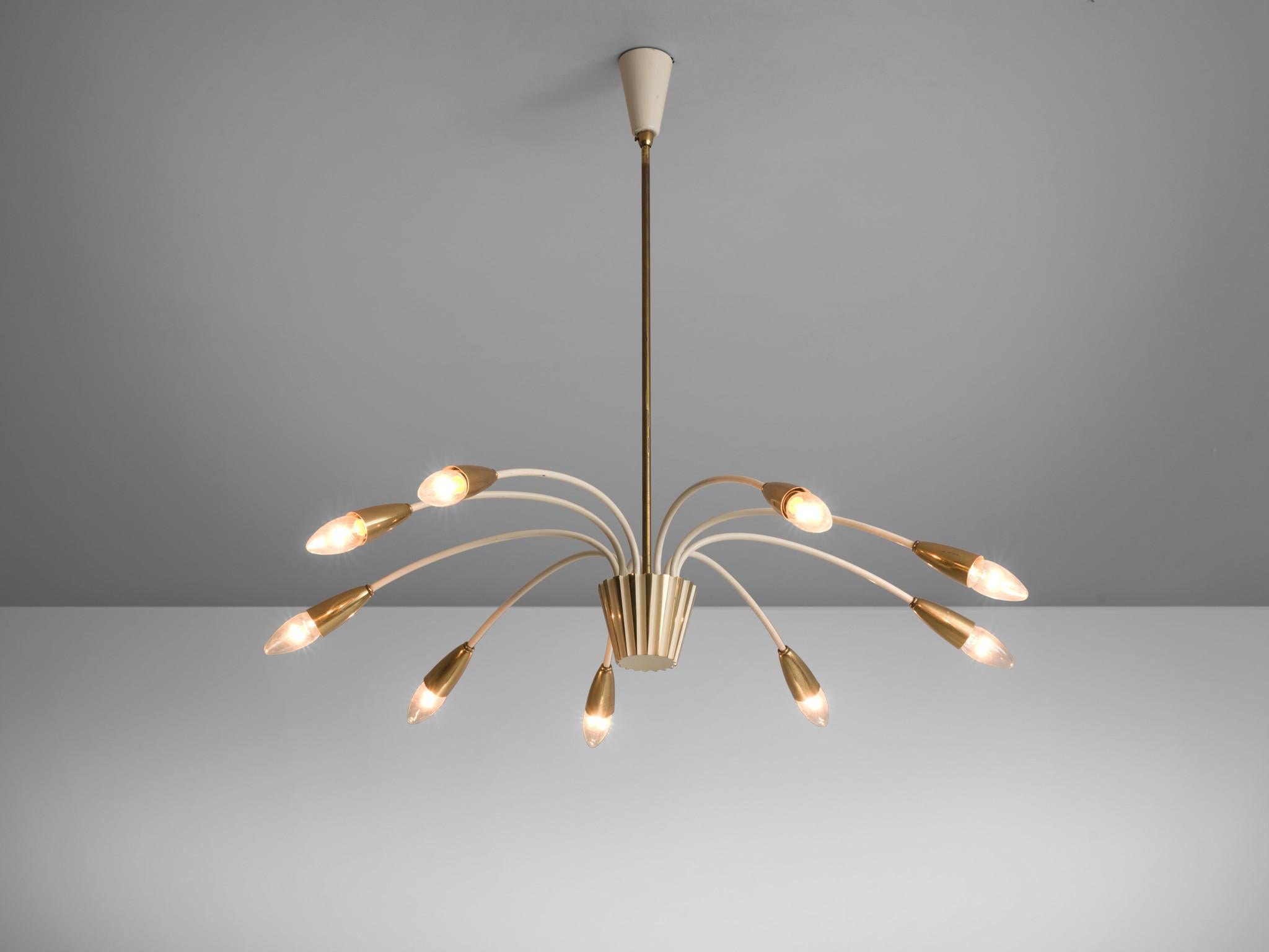 Pendant, brass, white-coated metal, glass, Italy, circa 1960s. 

This brass, large nine armed biomorphic pendant is both modern and classic at the same time, a trait that Italian lights often achieve. The chandelier is delicate thanks to the sleek