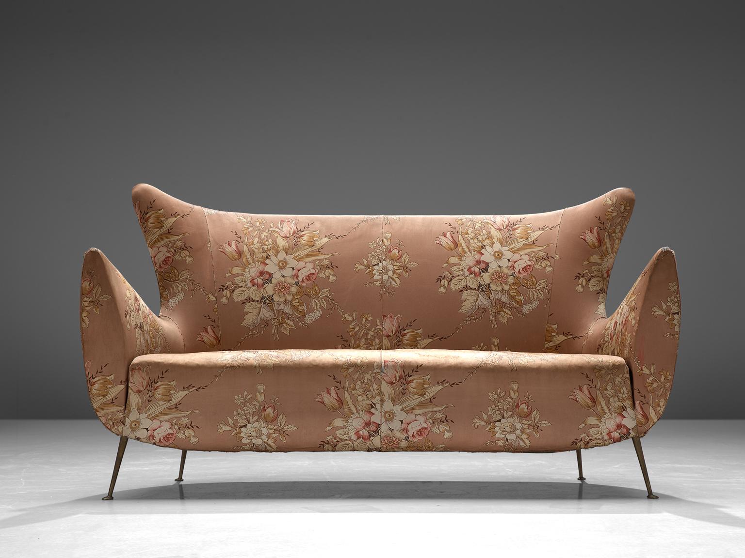 Italian sofa, fabric and metal, Italy, 1950s.

This sofa is an iconic example of Italian design from the 1950s. Organic and sculptural, this two-seat sofa is anything but minimalistic. Equipped with the original stiletto brass feet which are narrow