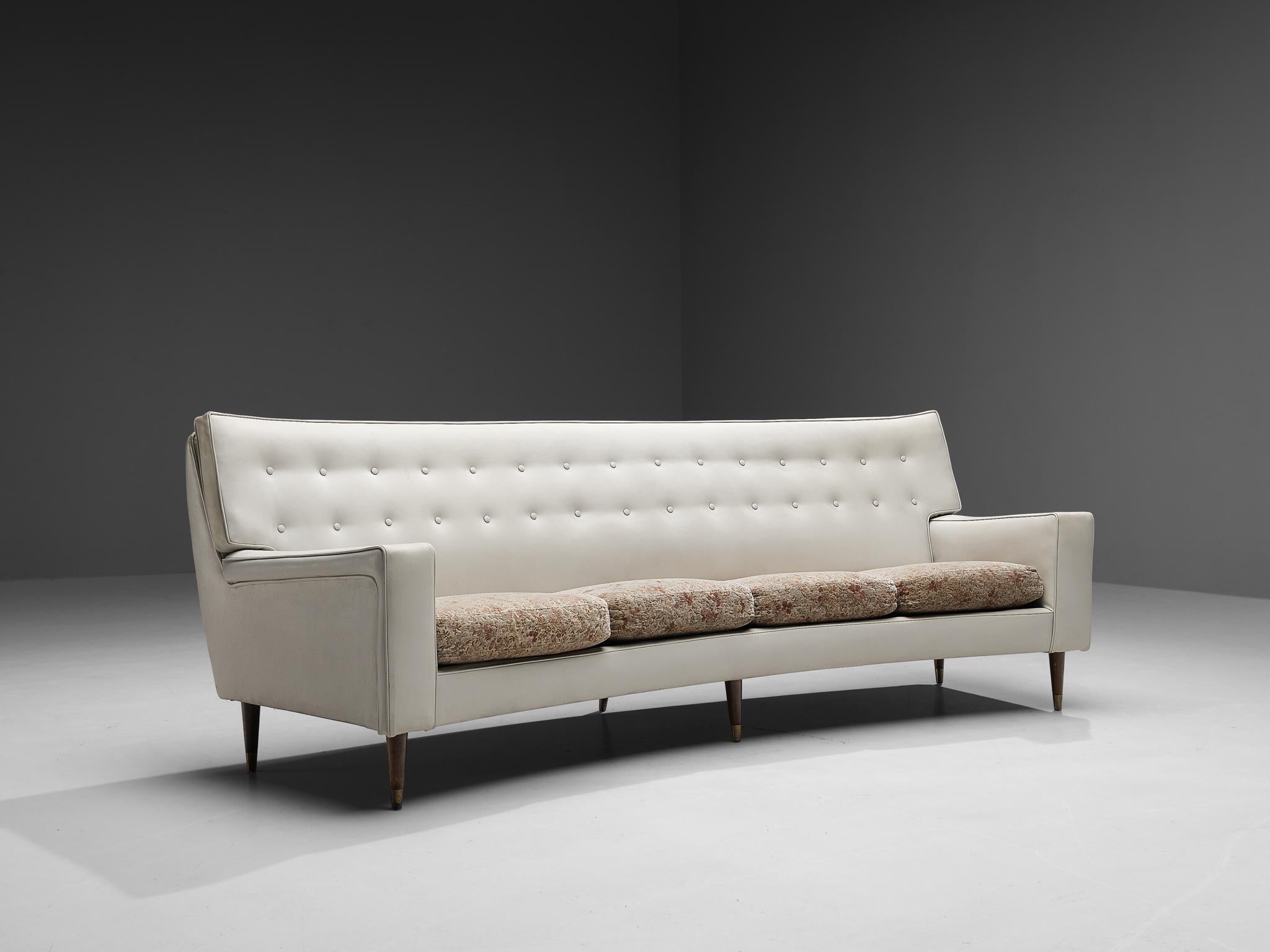 Sofa, leatherette, fabric, wood, brass, Italy, 1970s 

This charming looking sofa owes its elegancy to the curved shape of the body and high, imposed backrest. The seat is upholstered in white leatherette and shows beautiful buttons placed on two