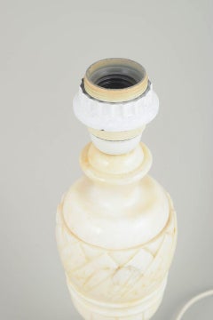 Elegant Italian table lamp crafted in white marble. 1970s